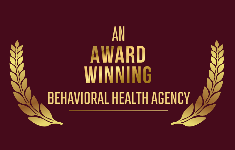 An award winning behavioral health agency logo with gold laurel wreaths