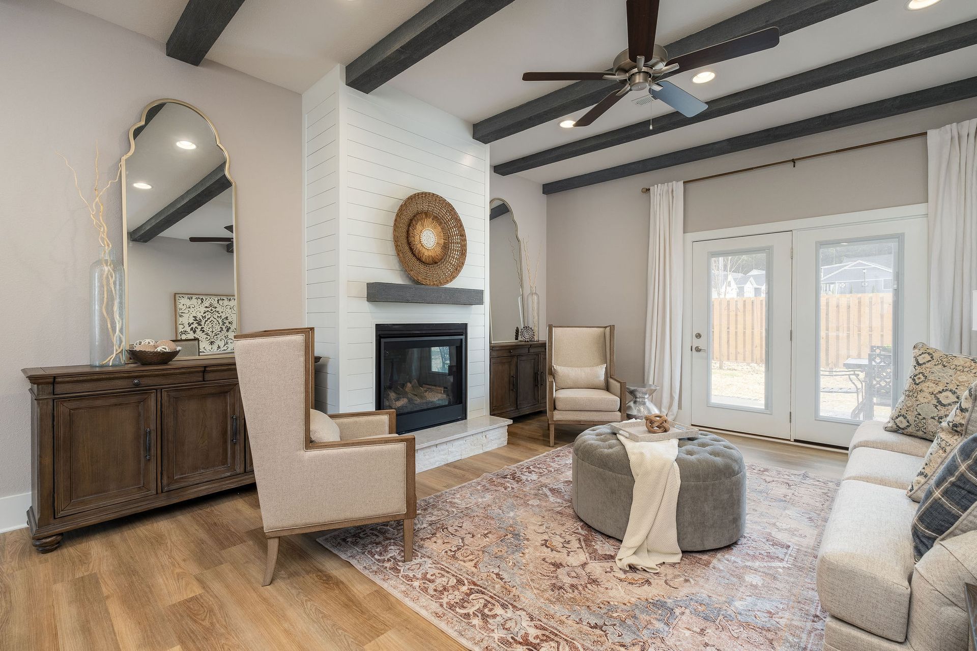 There is a fireplace in the middle of the living room.