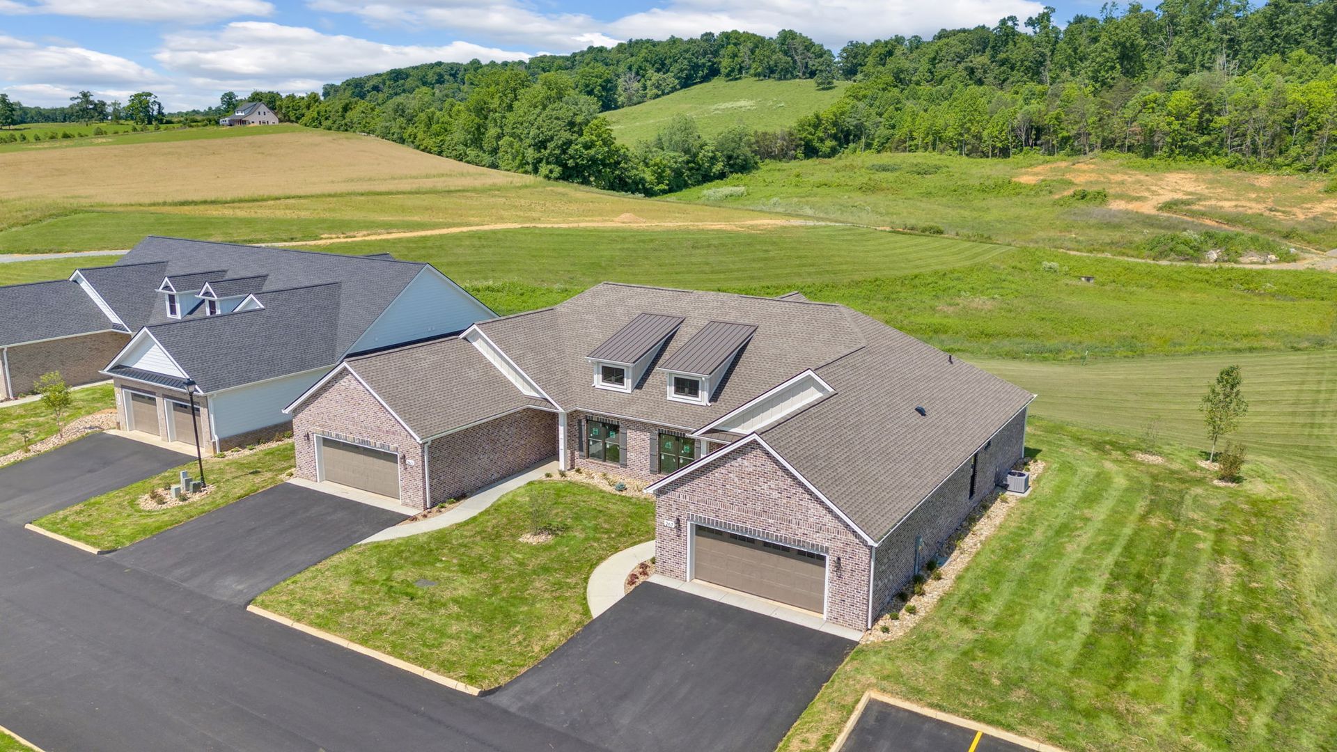 An aerial view of a row of houses in a residential area.