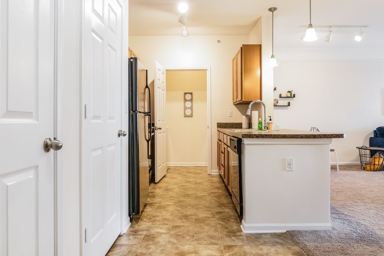 Kitchen with black appliances and a large island in the middle of the room in Johnson City