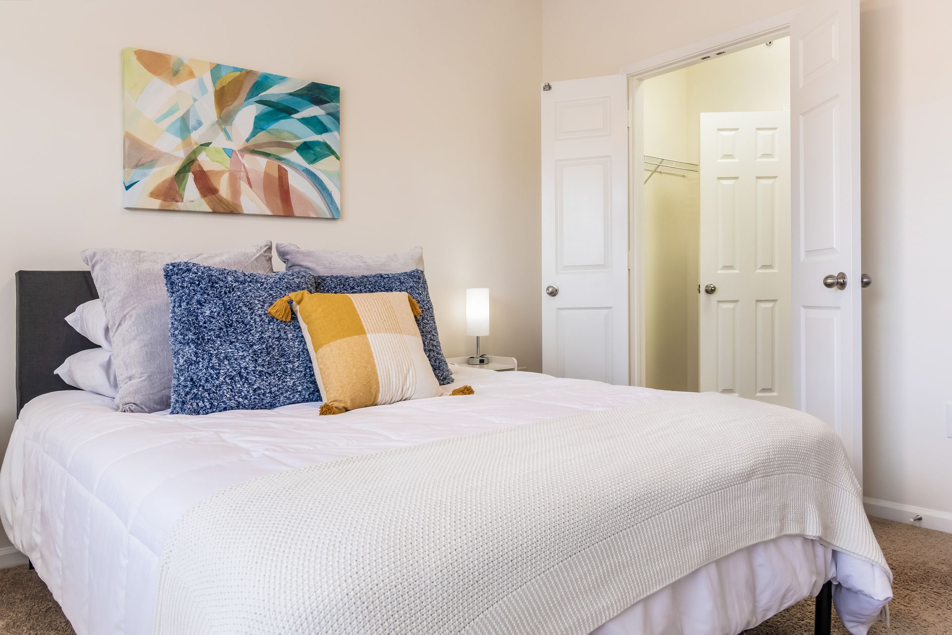 Bedroom with a bed and a painting on the wall in Johnson City