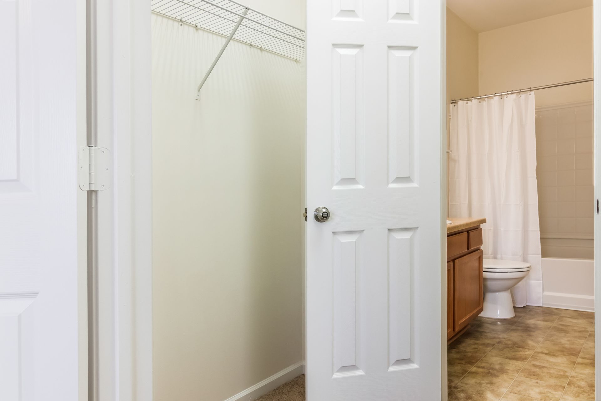 Bathroom with a toilet , sink and shower curtain in Johnson City