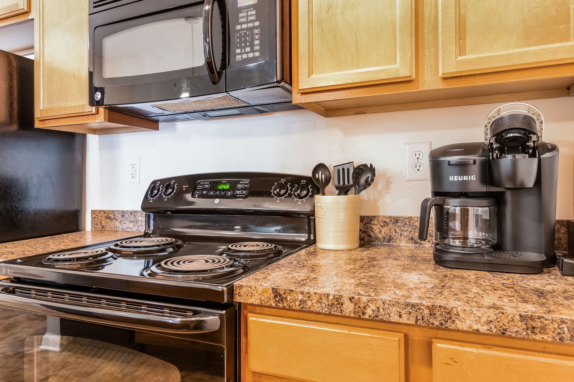 Kitchen with a stove , microwave , and coffee maker in Johnson City