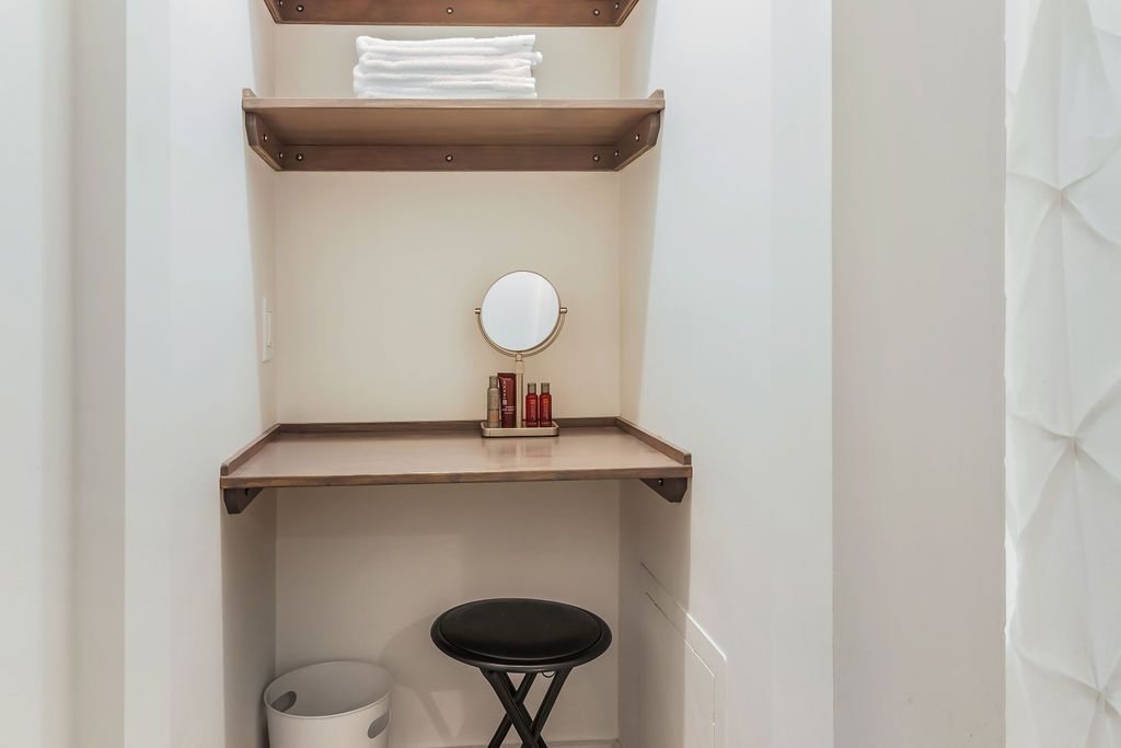 Fully equipped bathroom with a vanity , mirror and stool, Mystic, CT