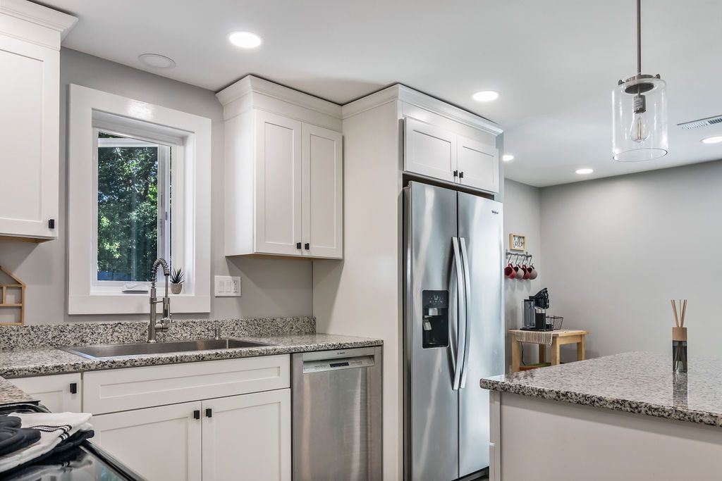 Fully equipped kitchen with stainless steel appliances and granite counter tops in Mystic, CT