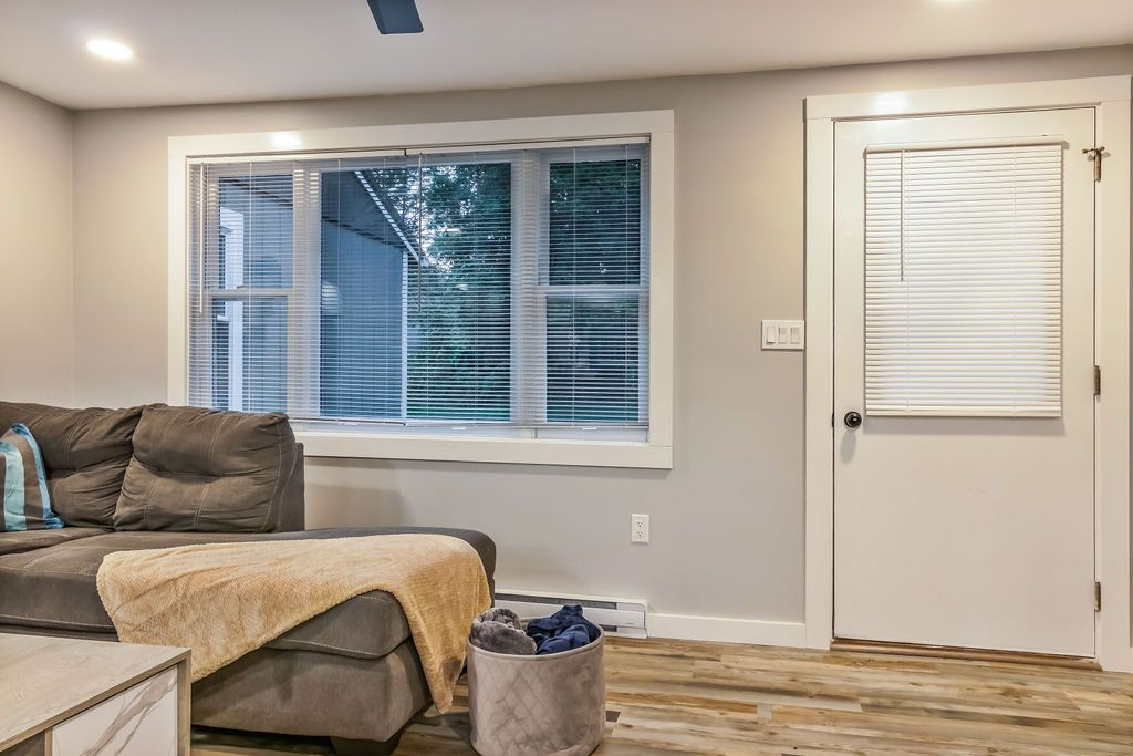 Furnished living room with a couch and a window in Mystic, CT