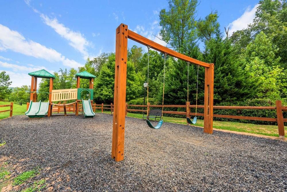 Wooden playground with swings and a slide