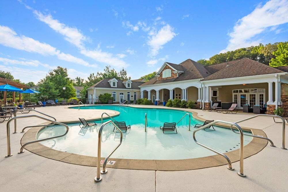 Large swimming pool in front of a house