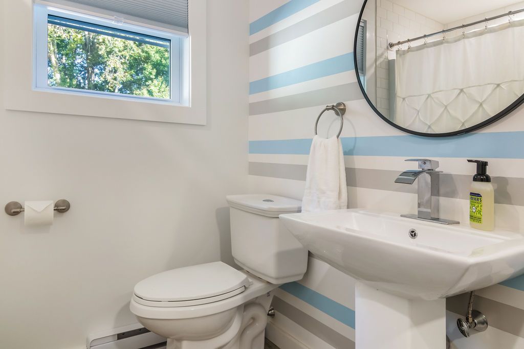 Bathroom with a toilet , sink and mirror Mystic, CT