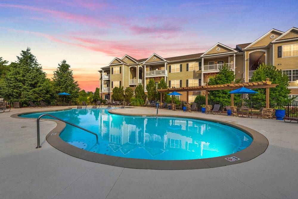 Large swimming pool in front of a building.