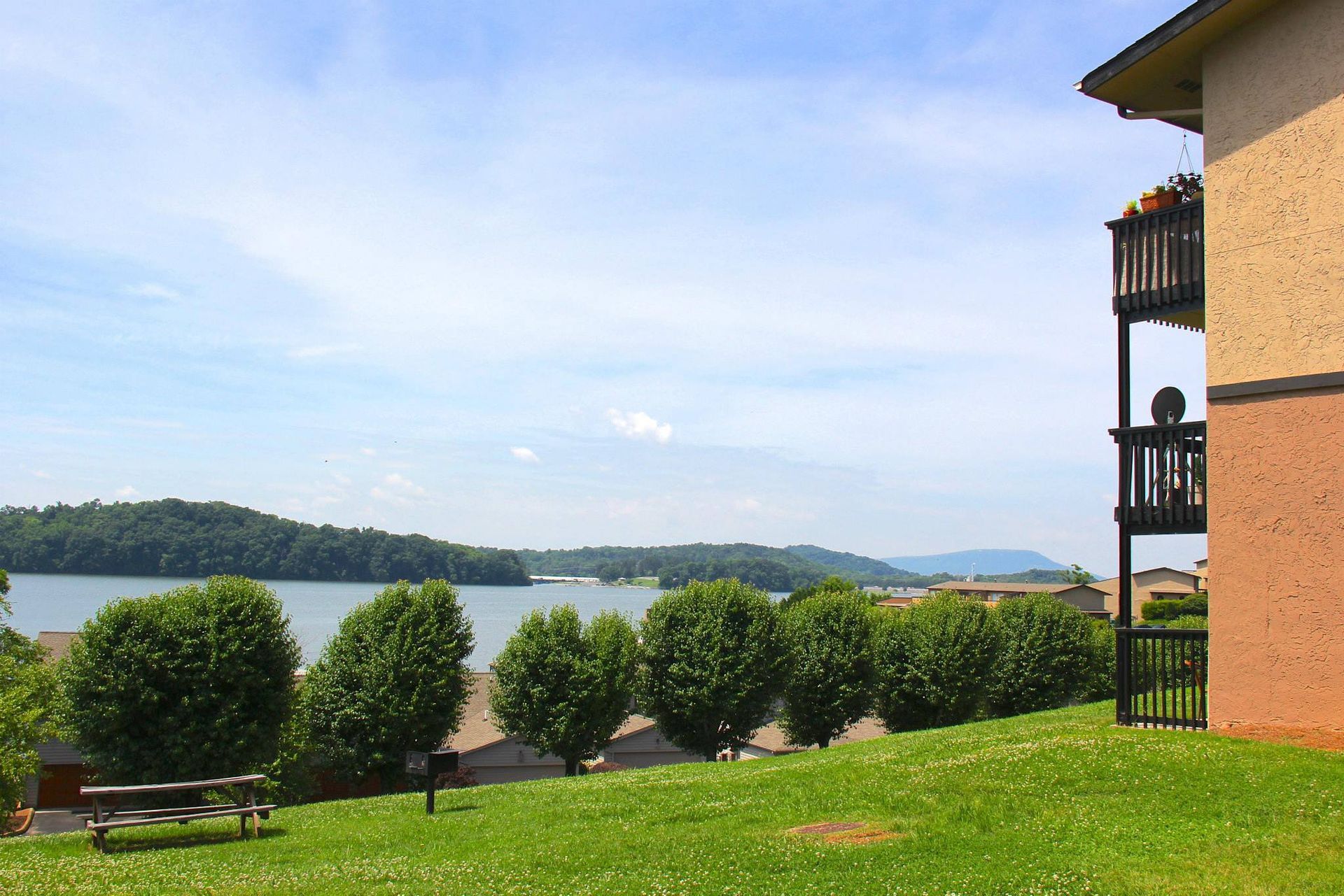 A building with a balcony overlooking a lake