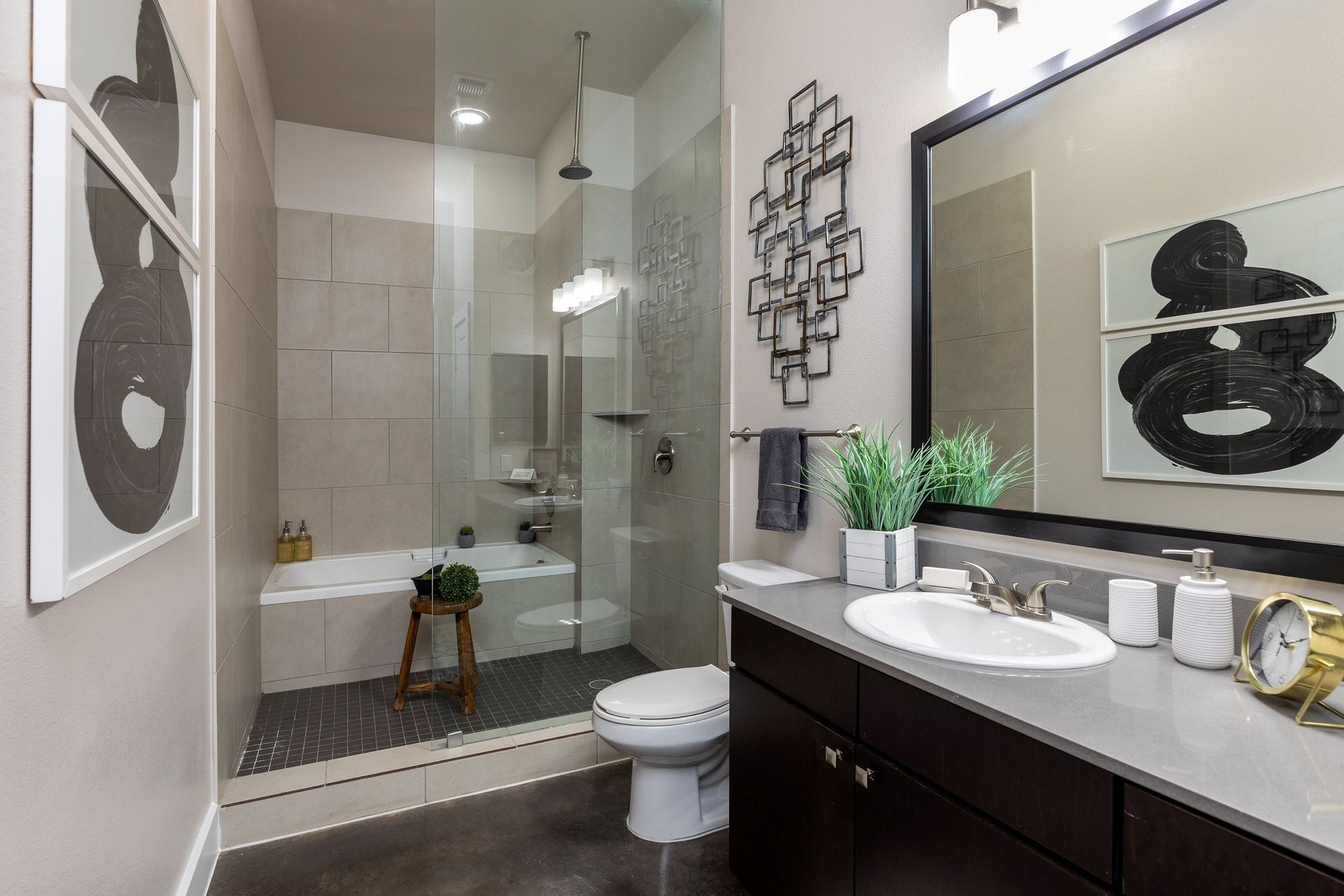 A bathroom with a sink , toilet , bathtub and walk in shower.