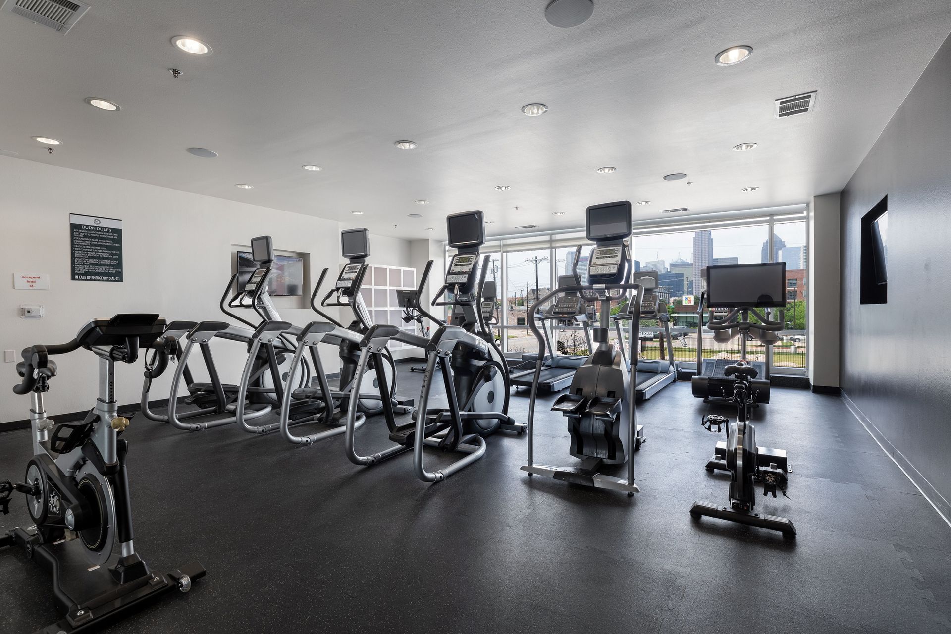 A large gym with a lot of exercise equipment