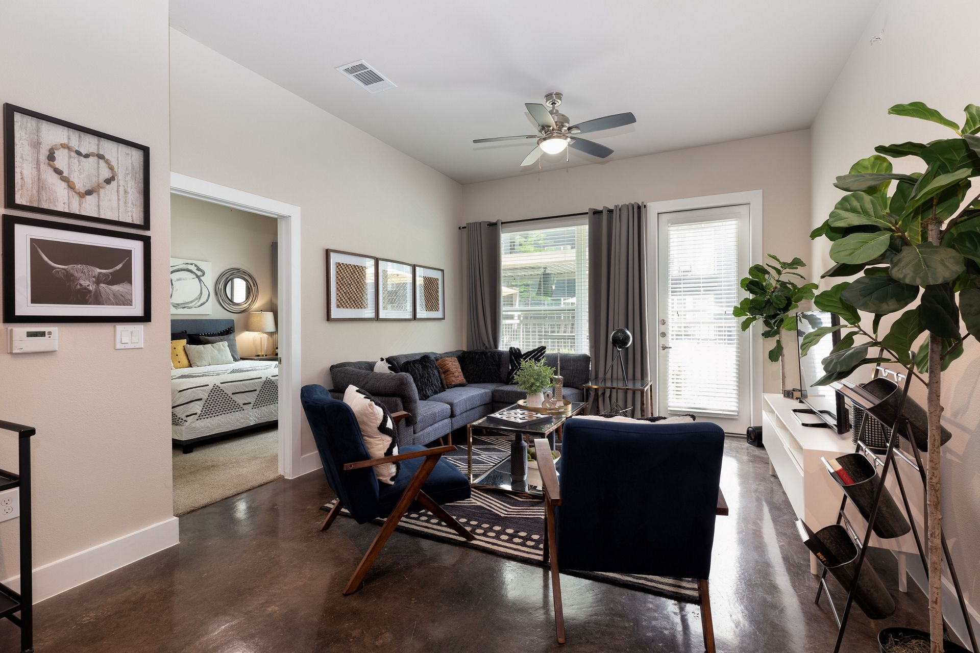 A bathroom with a sink , toilet , mirror and walk in closet.