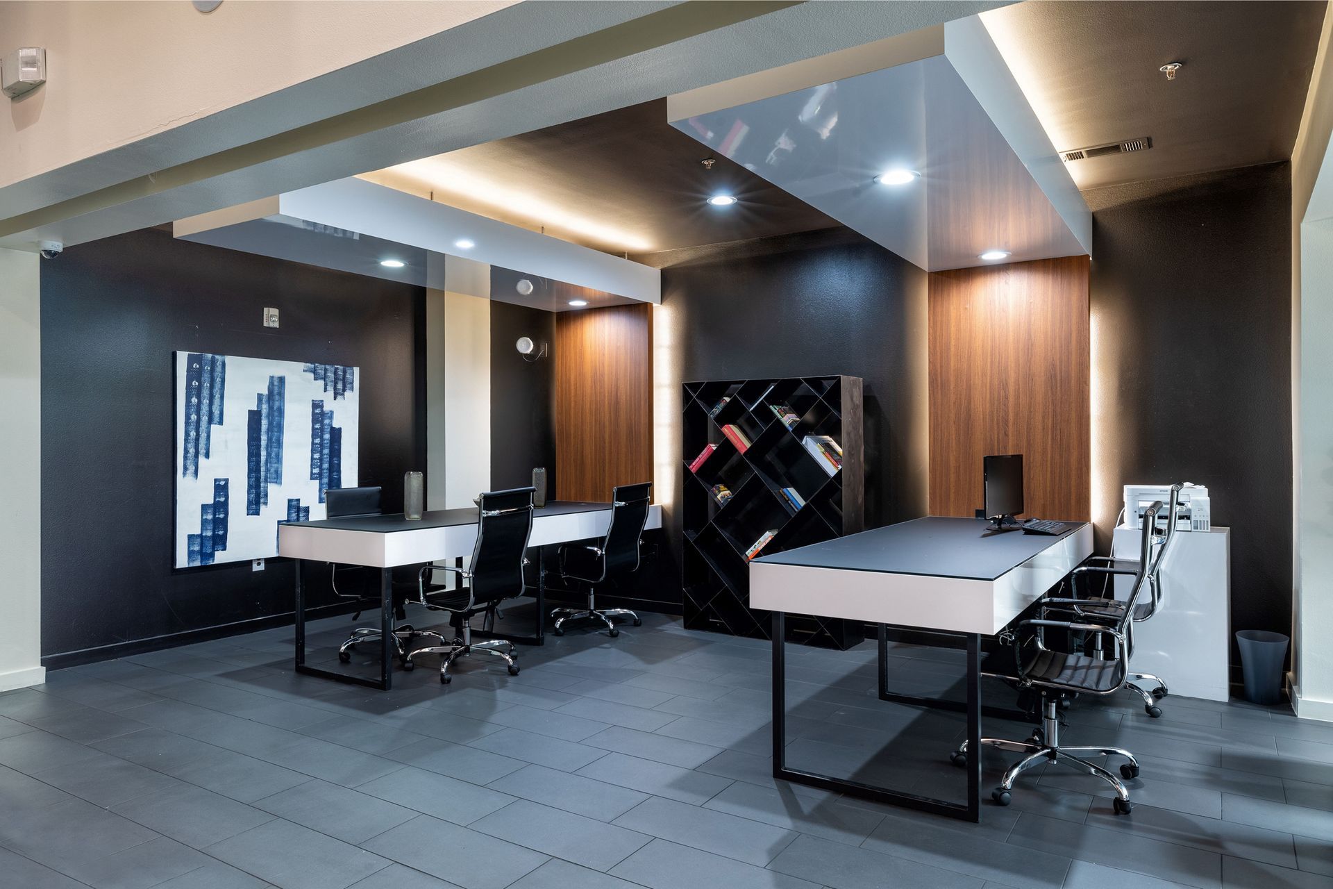 A room with a table and chairs in it