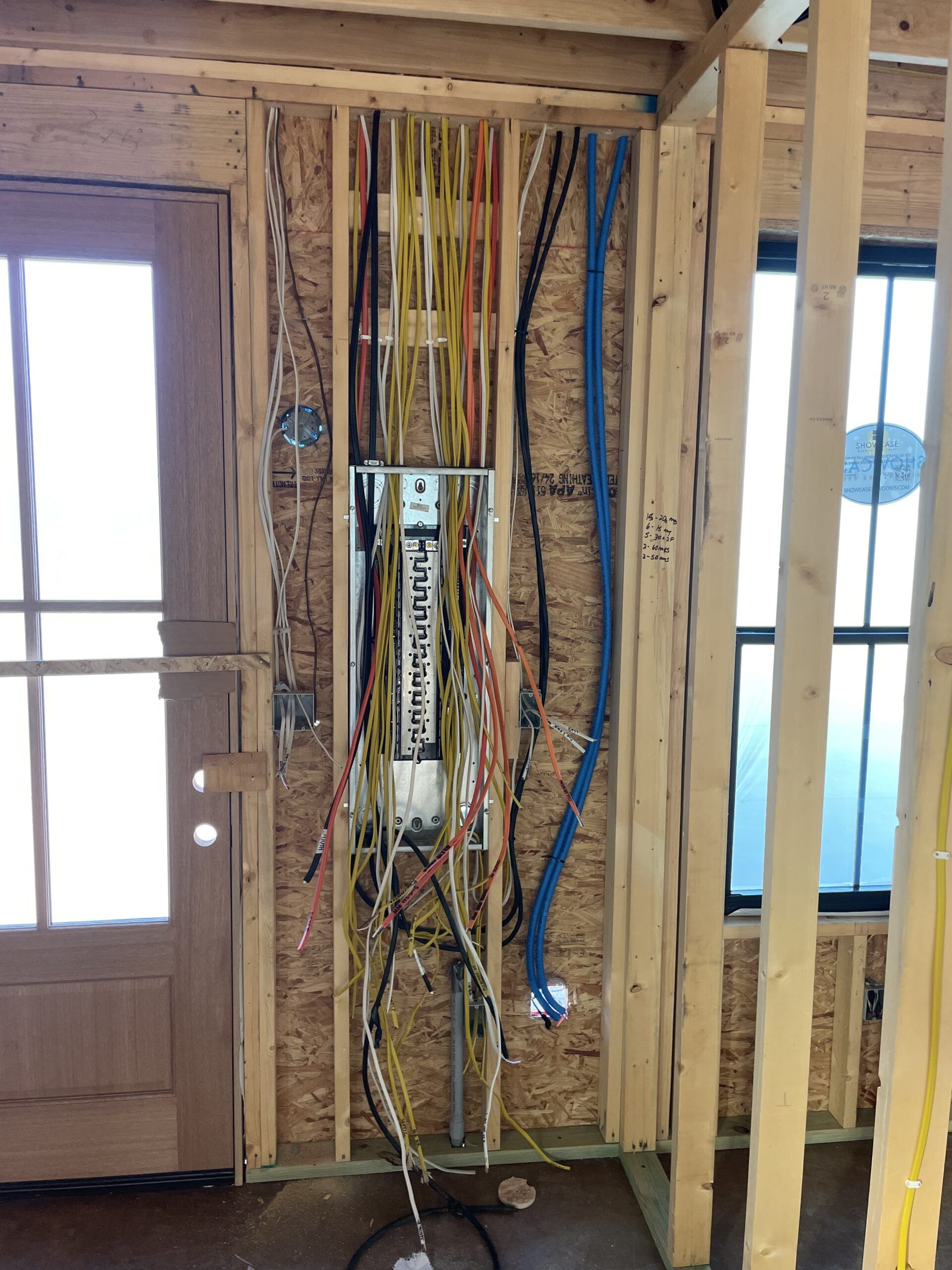 A man is plastering a wall in a room.