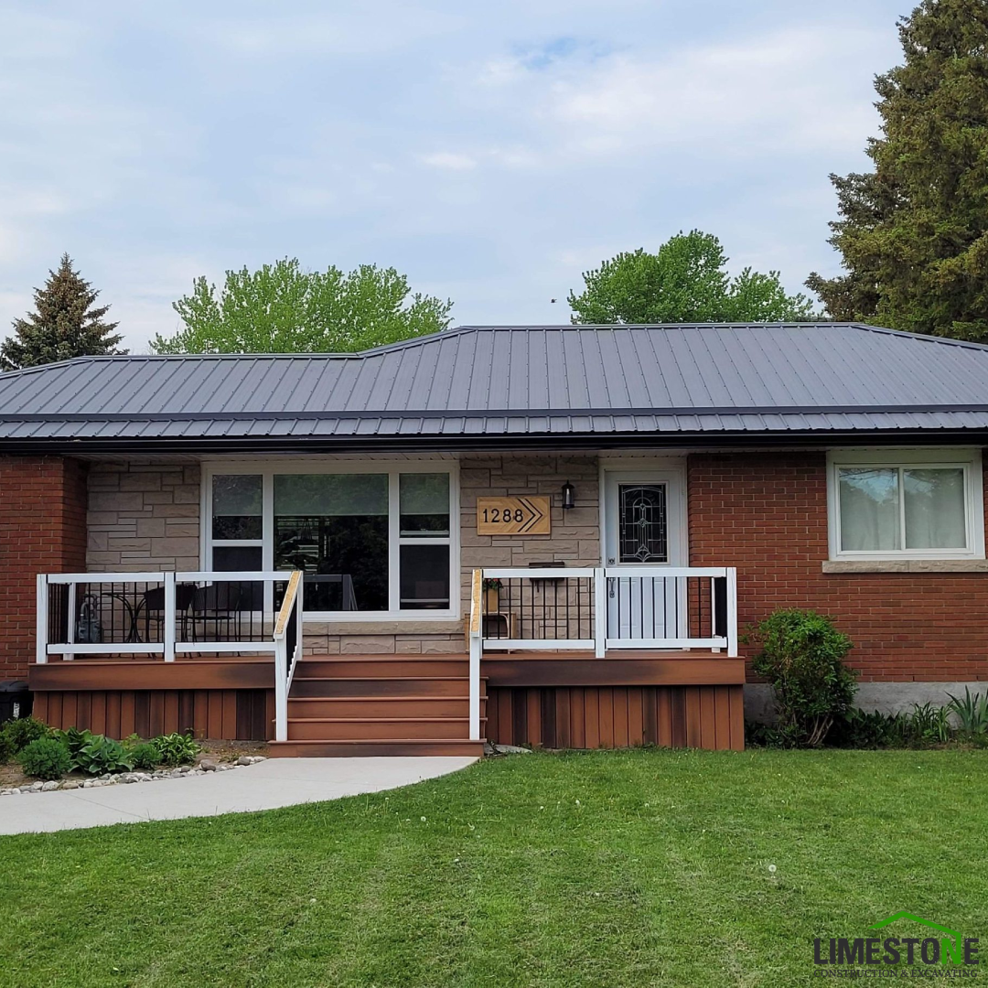 A brick house with a gray roof and a sign that says 1234
