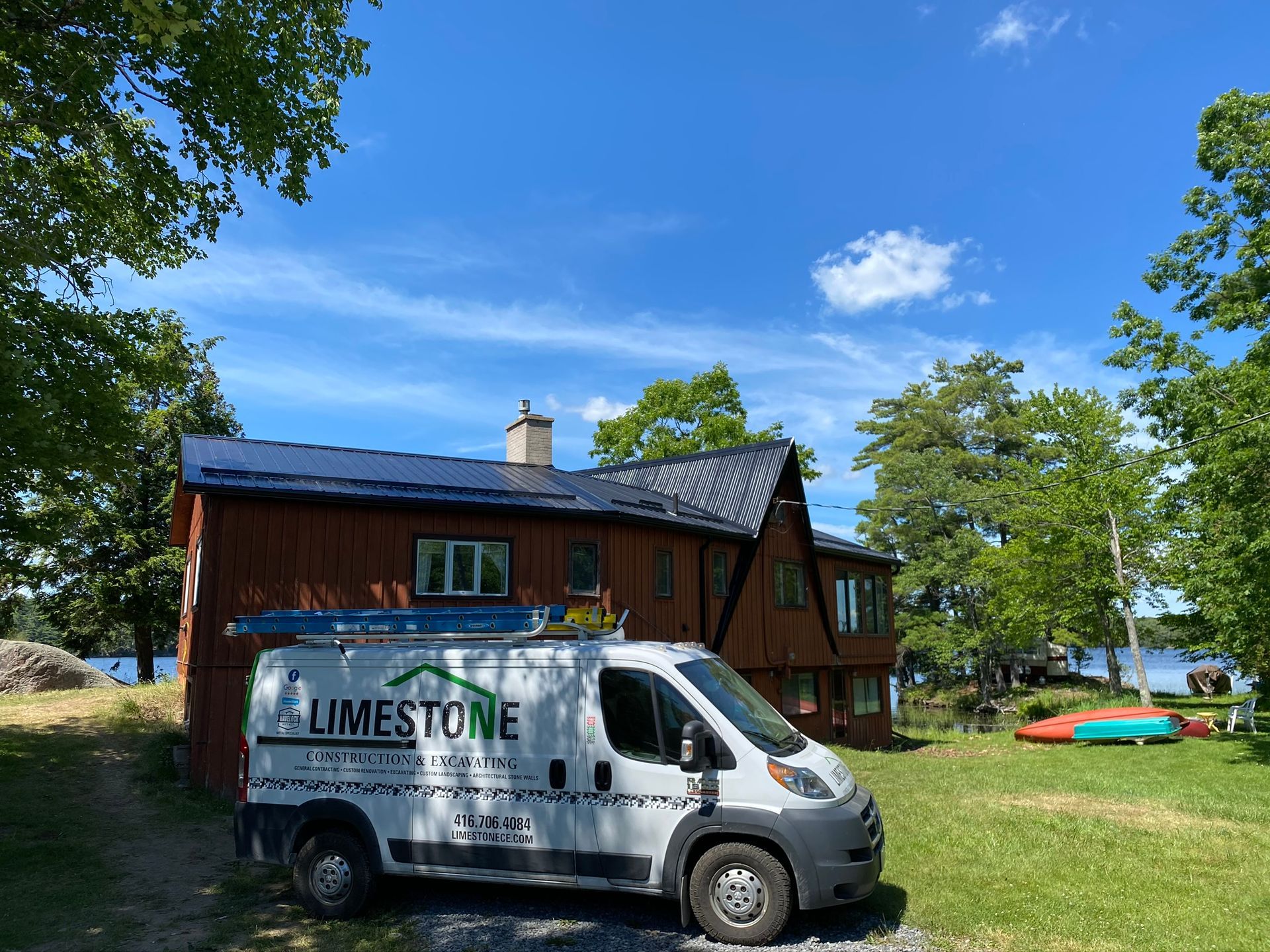 a limestone van is parked in front of a house .