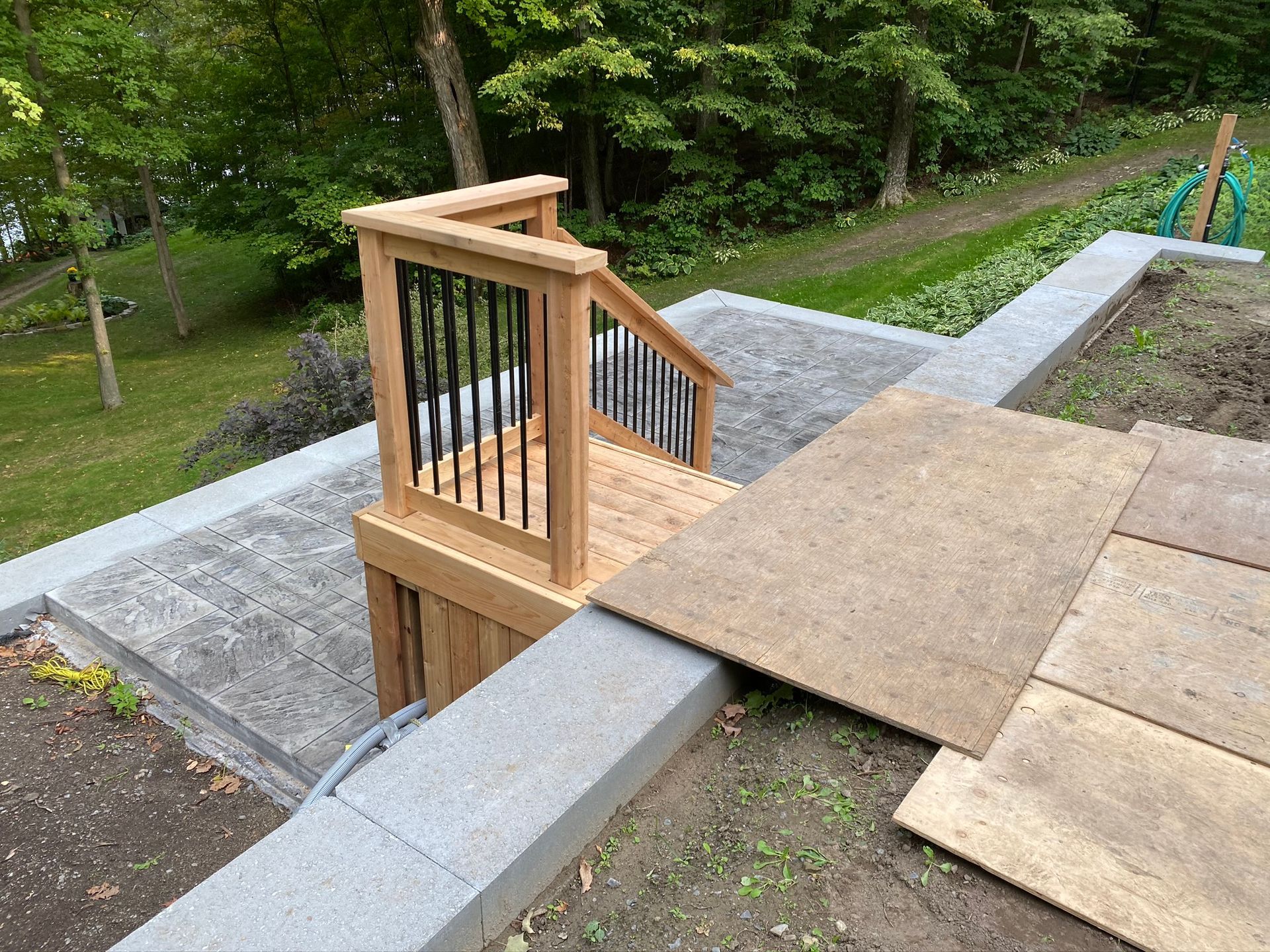 a wooden deck with stairs leading up to it .