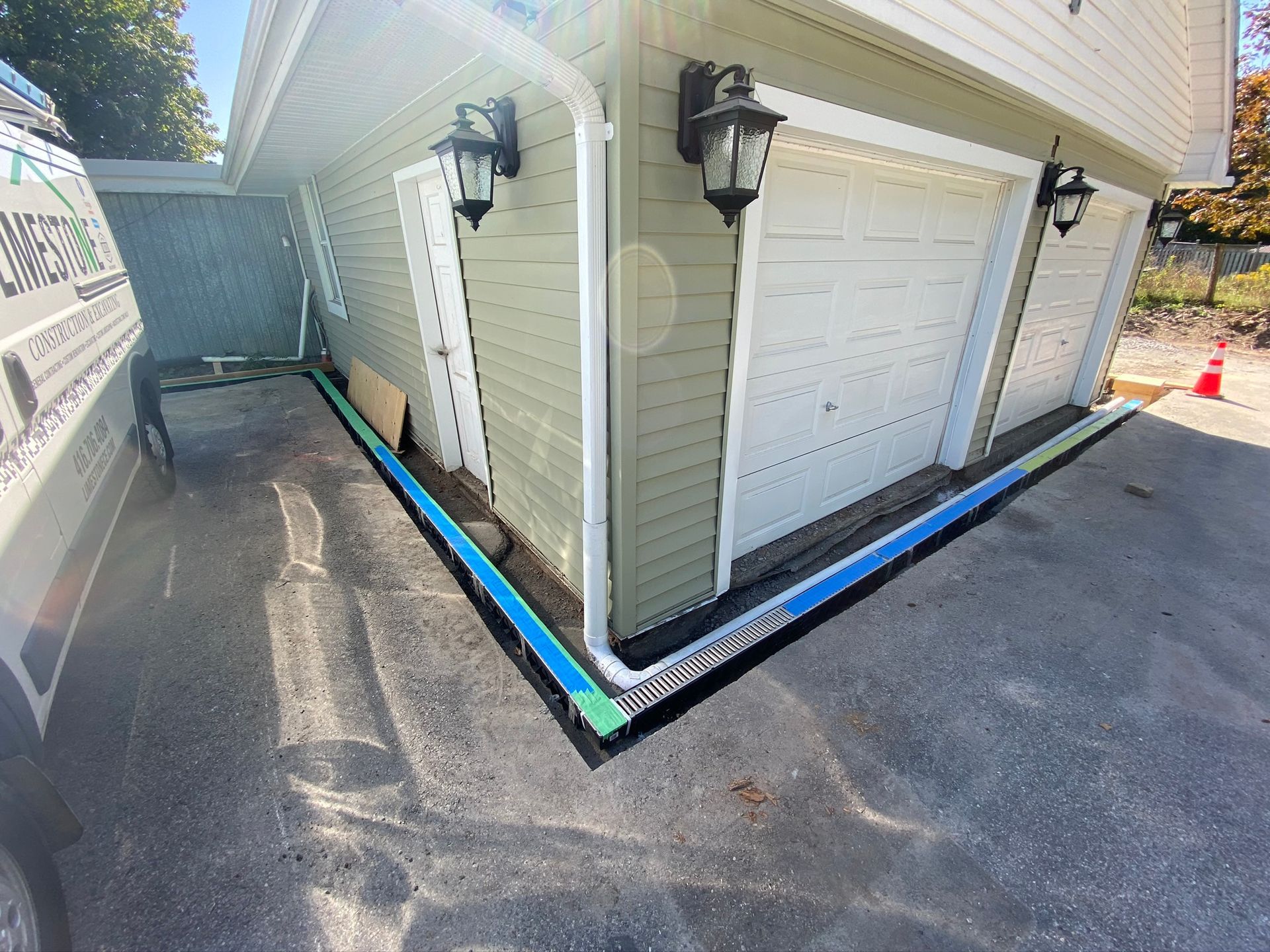 a garage door is being installed on the side of a house .