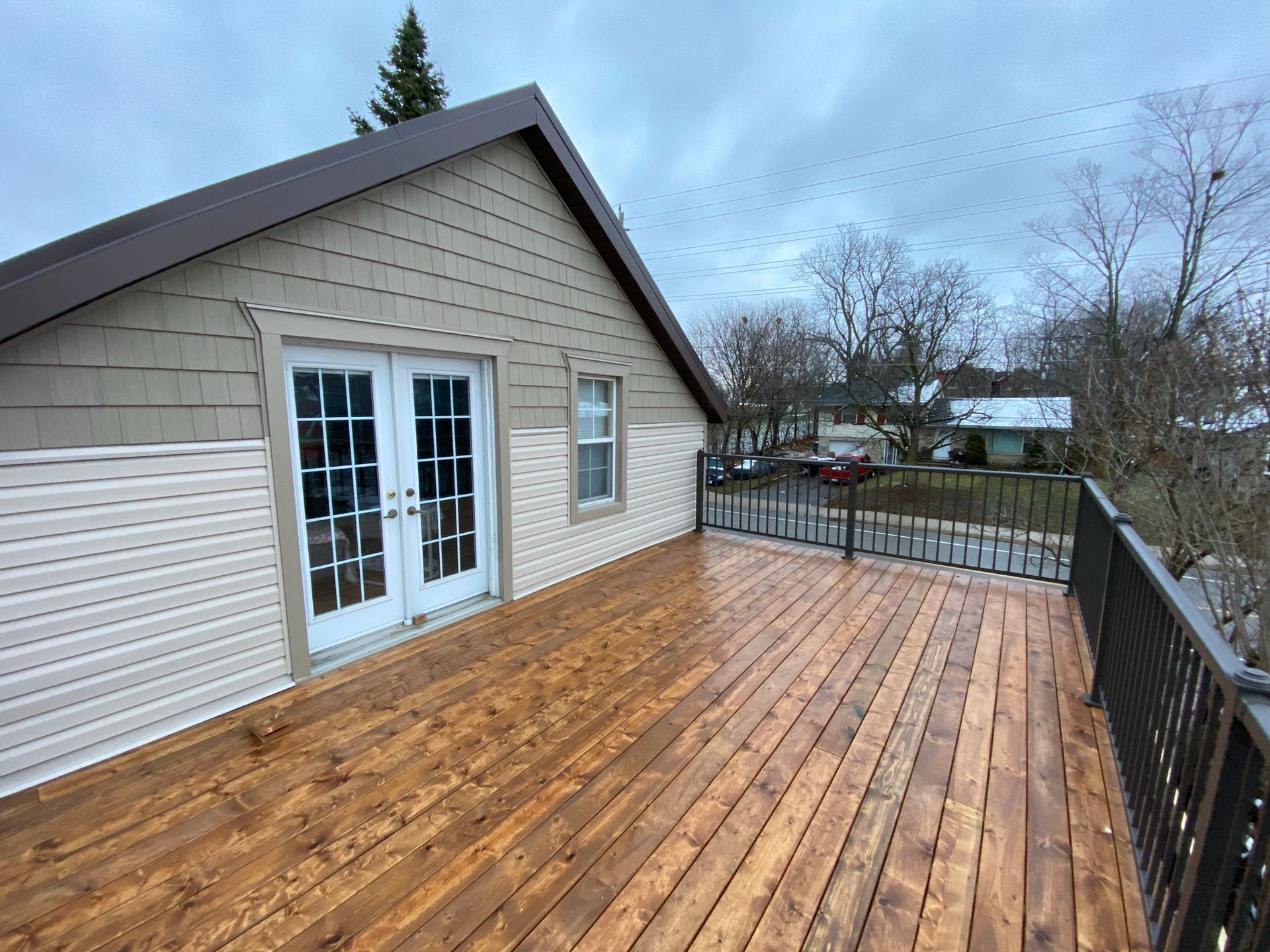 there is a large wooden deck on the roof of a house .