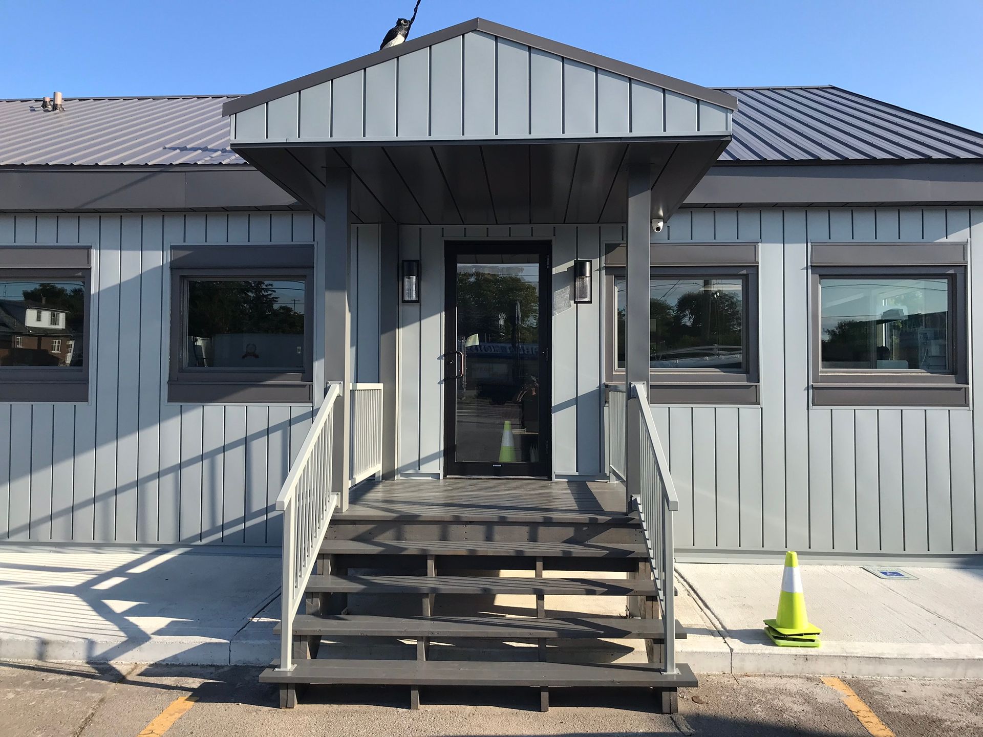 a house with stairs leading up to the front door