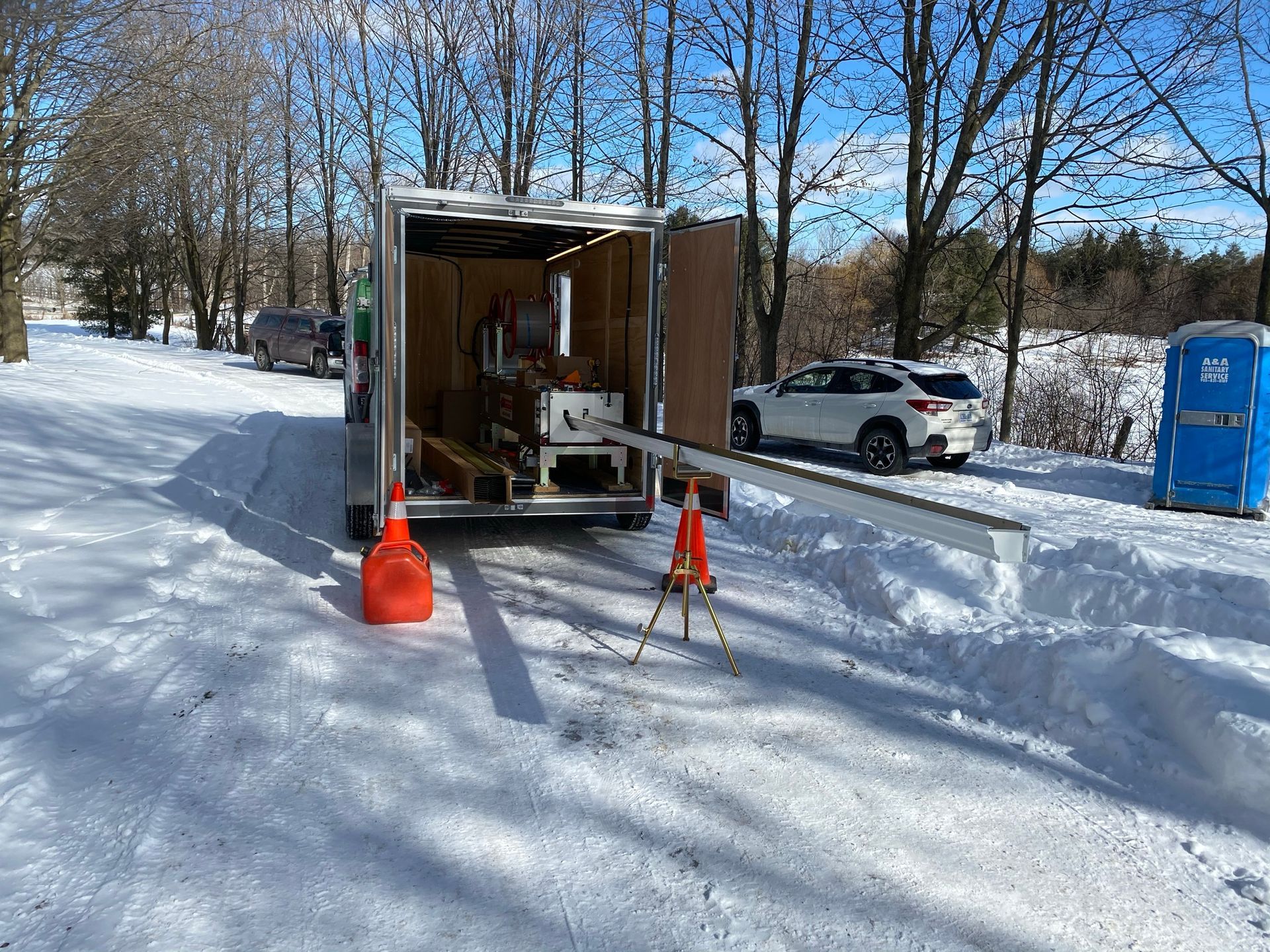 a trailer is parked in the snow