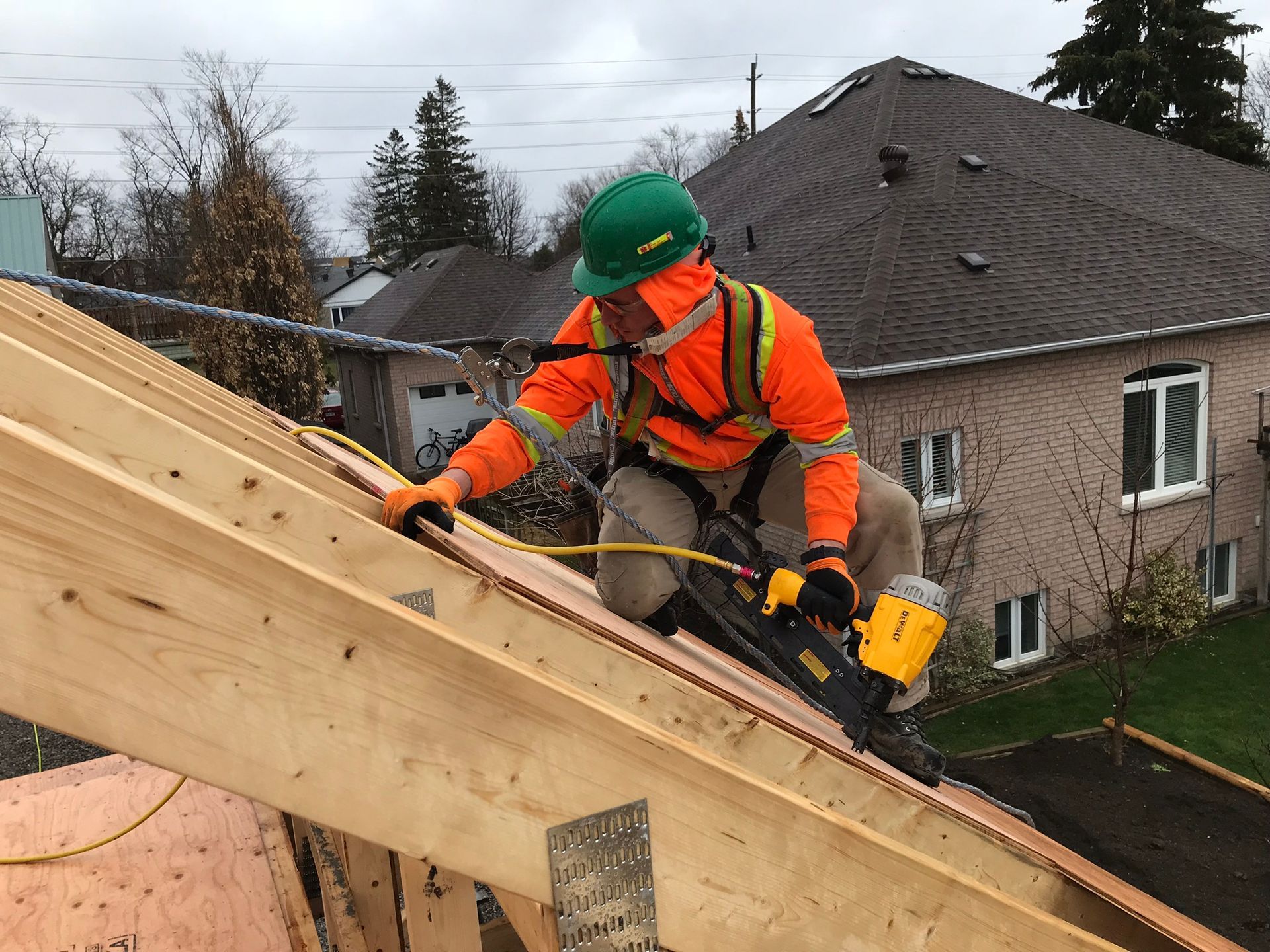 construction worker in process of installing a roof