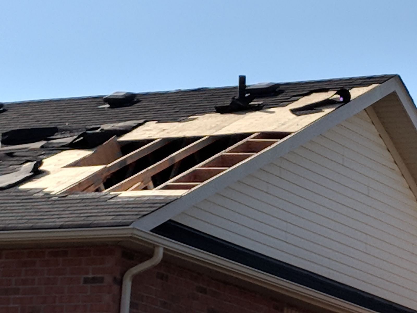 a house with a roof that is being repaired