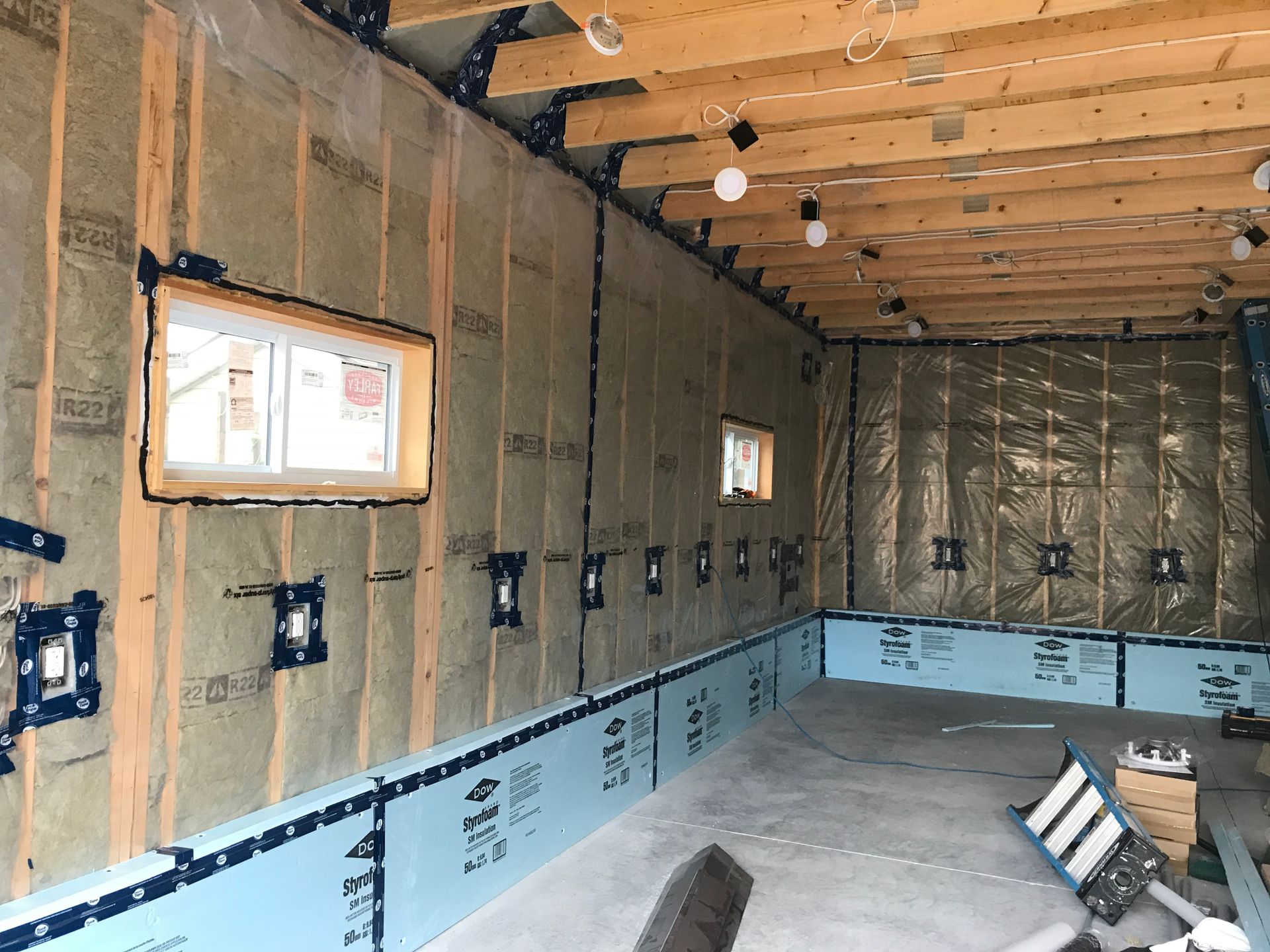 a room with a lot of insulation on the walls and ceiling .