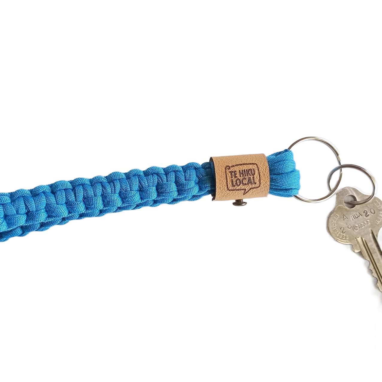 Blue woven lanyard with keys and a brown tag that reads