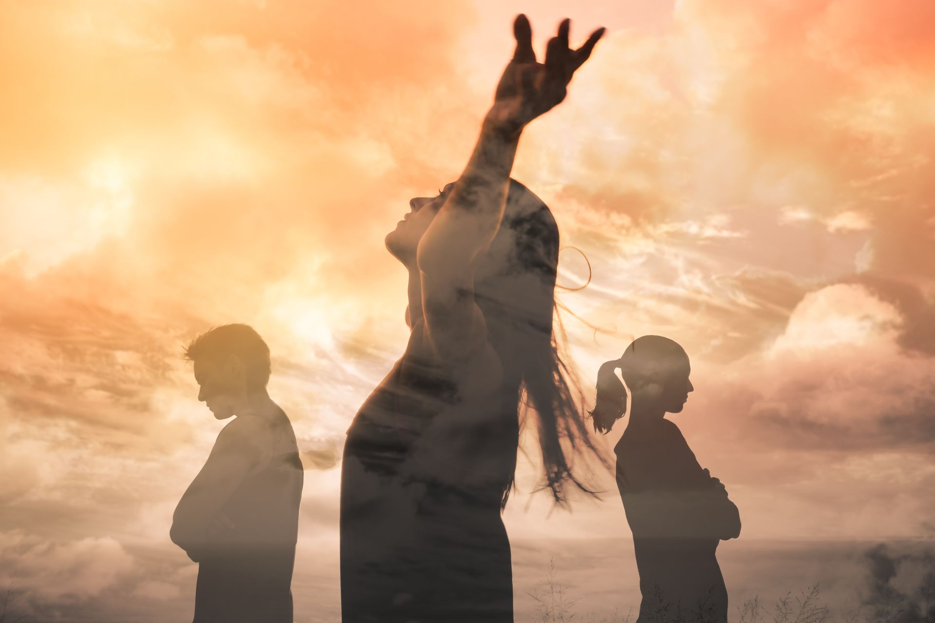 Woman with arms raised, silhouetted against a cloudy sky, with figures of two children below with arms crossed.