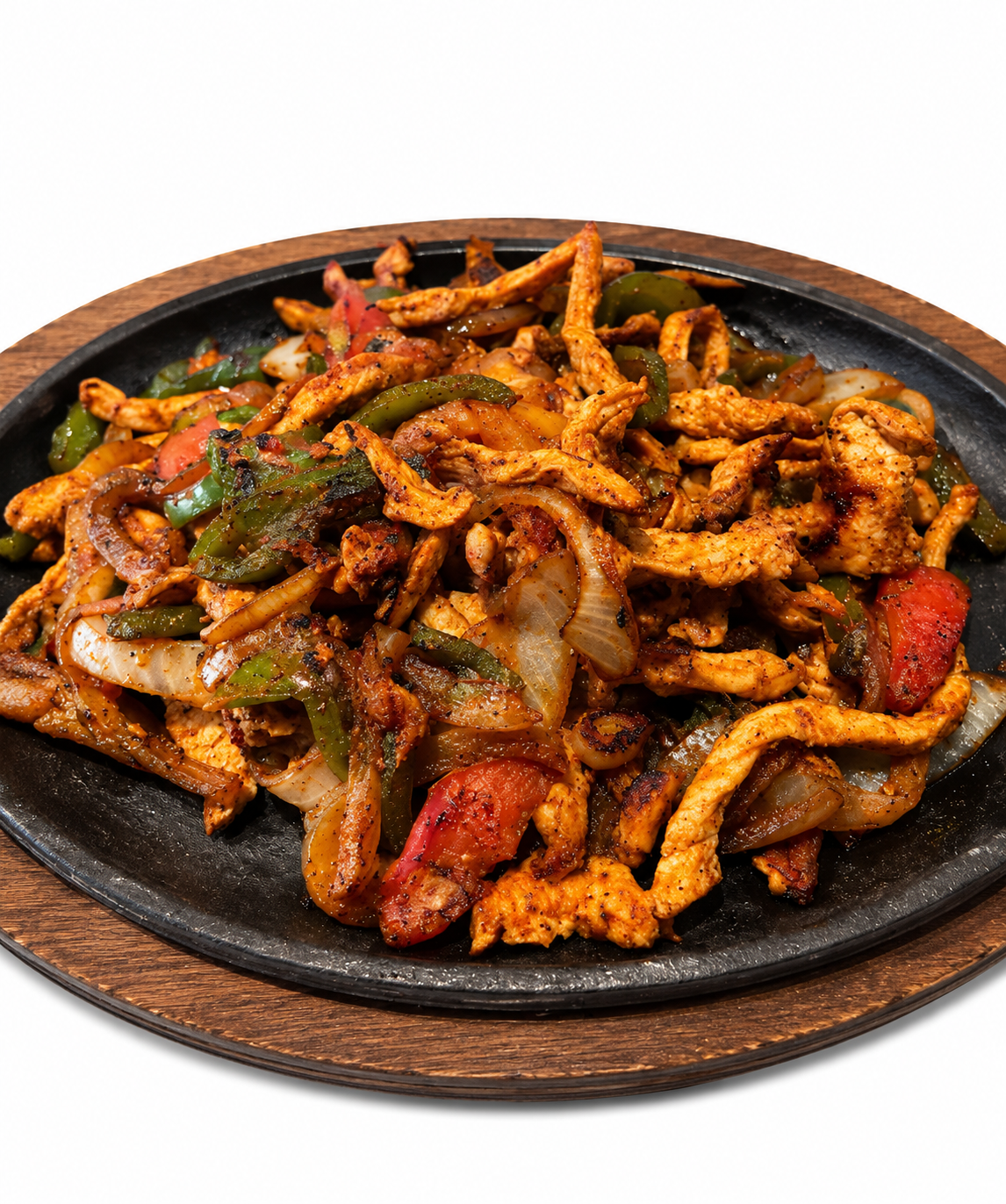 Grilled steak and chicken fajita platter with guacamole, sour cream, peppers, and tortillas on a wooden board Grilled steak and chicken fajita platter with guacamole, sour cream, peppers, and tortillas on a wooden board