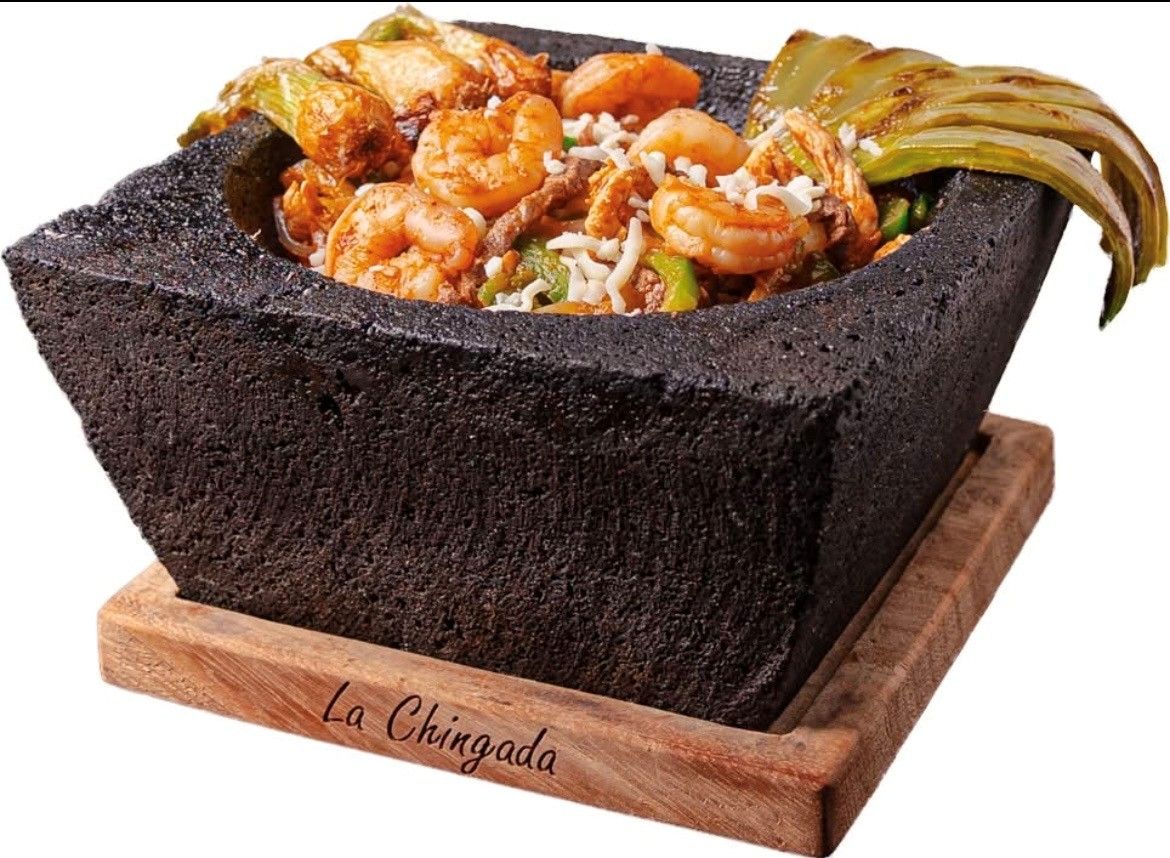 Assorted small appetizer toasts topped with vegetables and meats on white plates, arranged on a table.