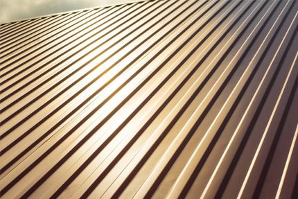 The sun is shining through the roof of a building.