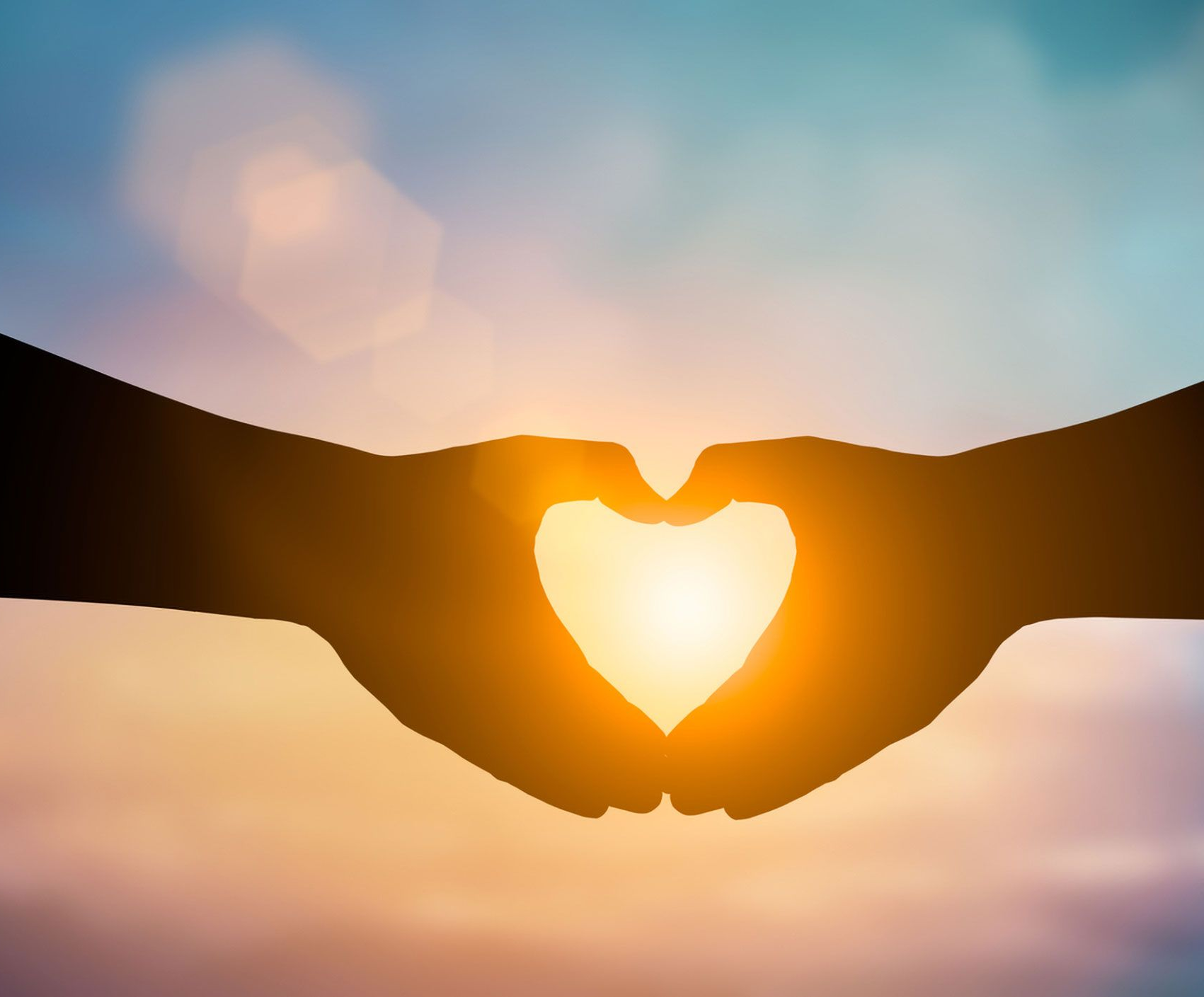 Silhouetted Hands Forming a Heart Shape — Lake Macquarie Counselling & Psychotherapy In Cardiff, NSW