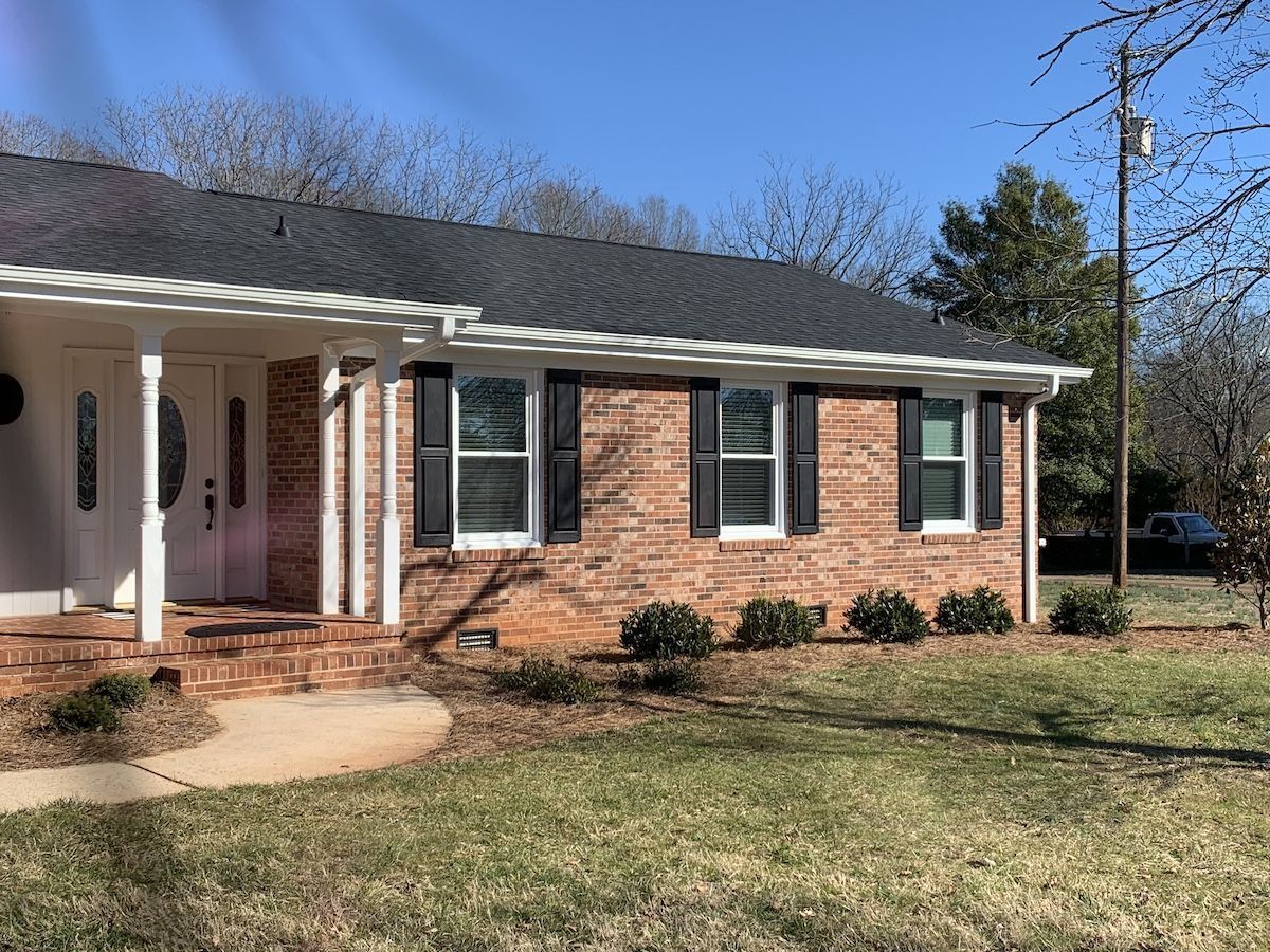 Brick House With Gutter — Liberty, SC — Premier Seamless Gutters
