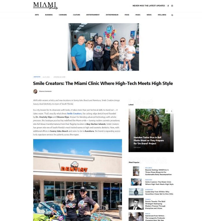 A group of people are posing for a picture in front of a building.