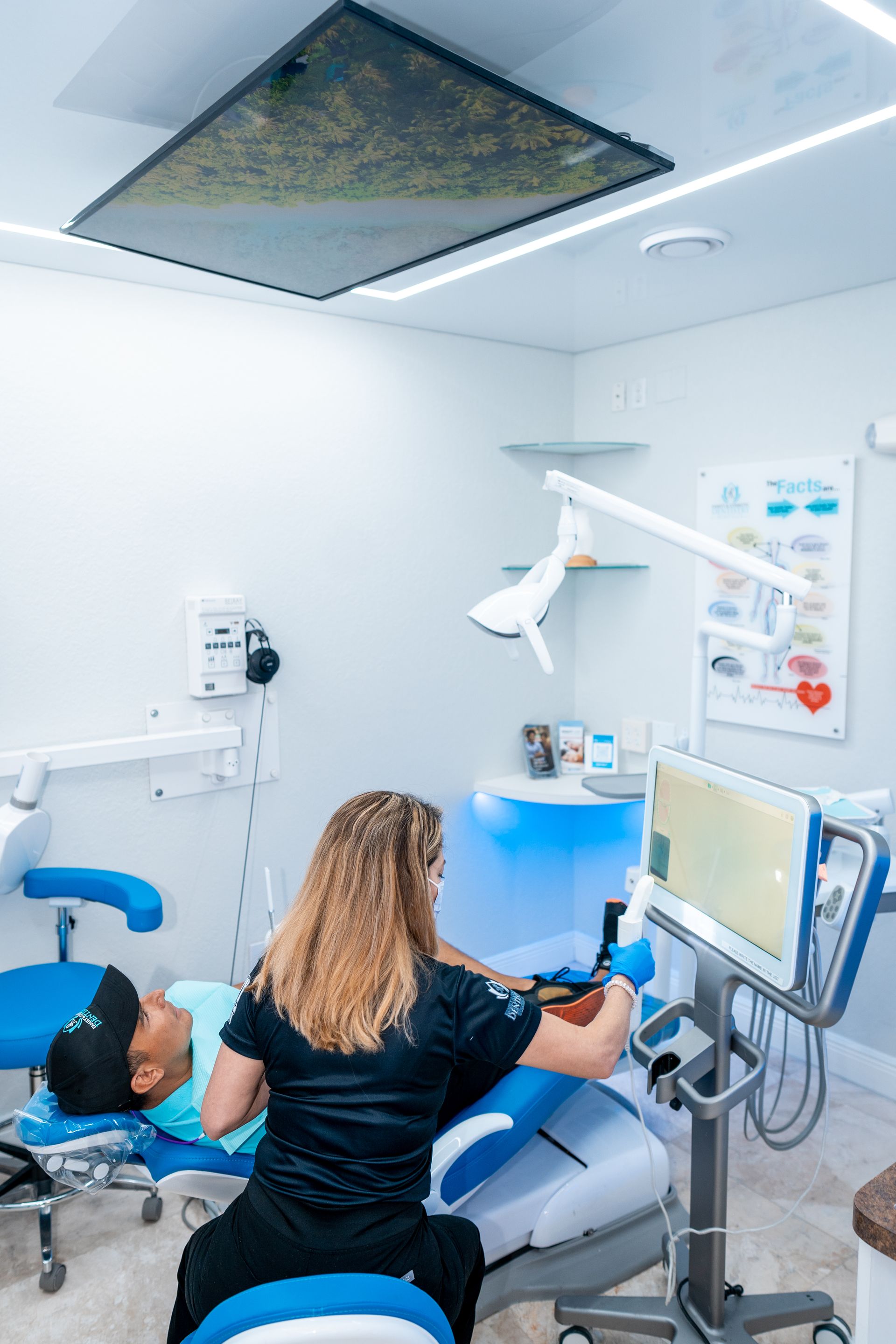 A woman is sitting at a table talking to a doctor.