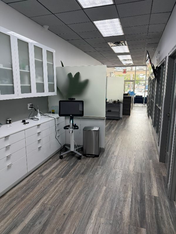 There are two chairs and a table in the hallway.