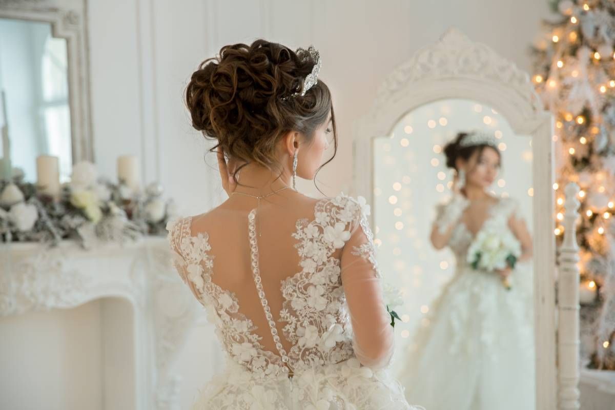 A bride getting ready for her wedding with a final check in the mirror near Lexington, Kentucky (KY)