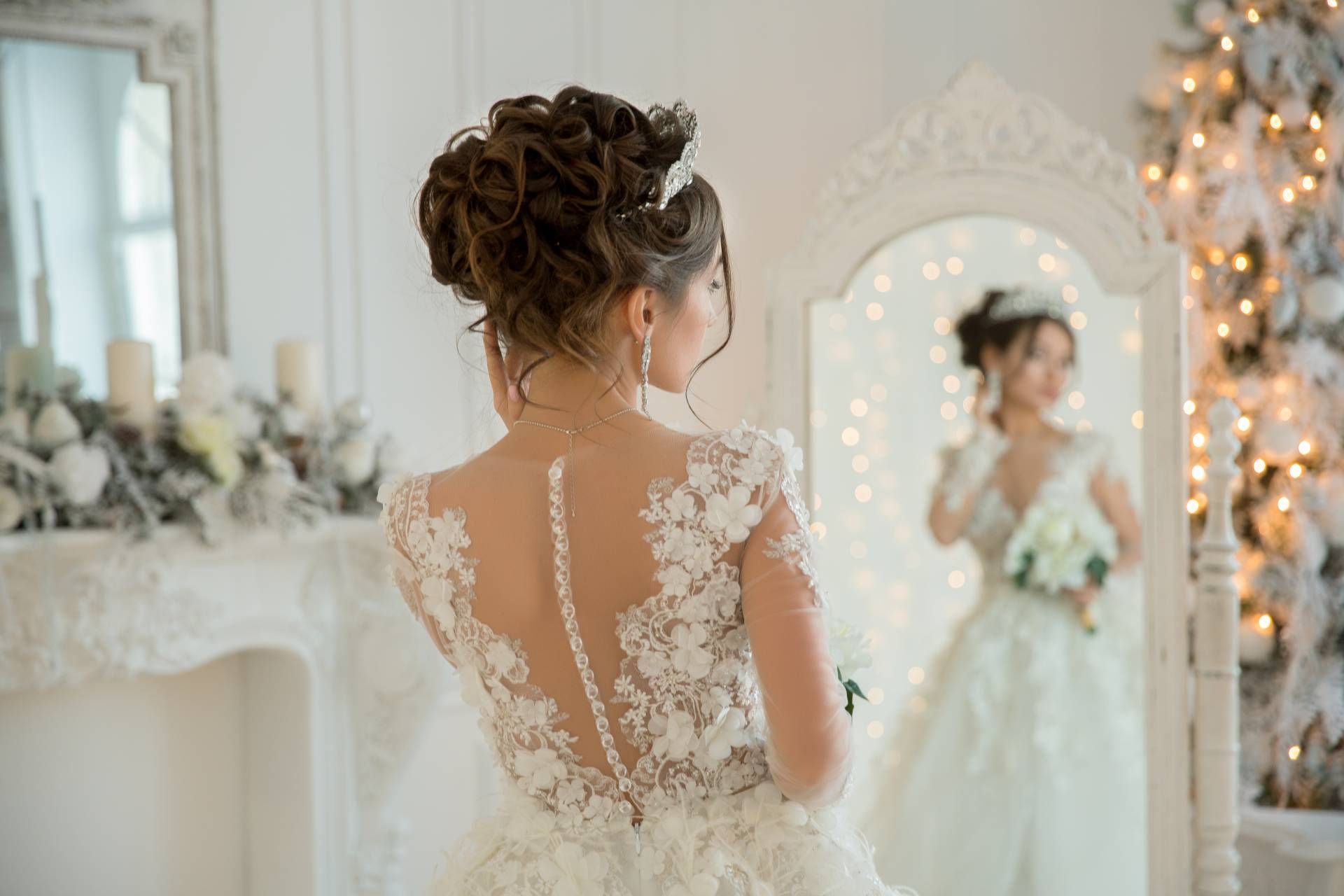 A bride getting ready for her wedding with a final check in the mirror near Lexington, Kentucky (KY)