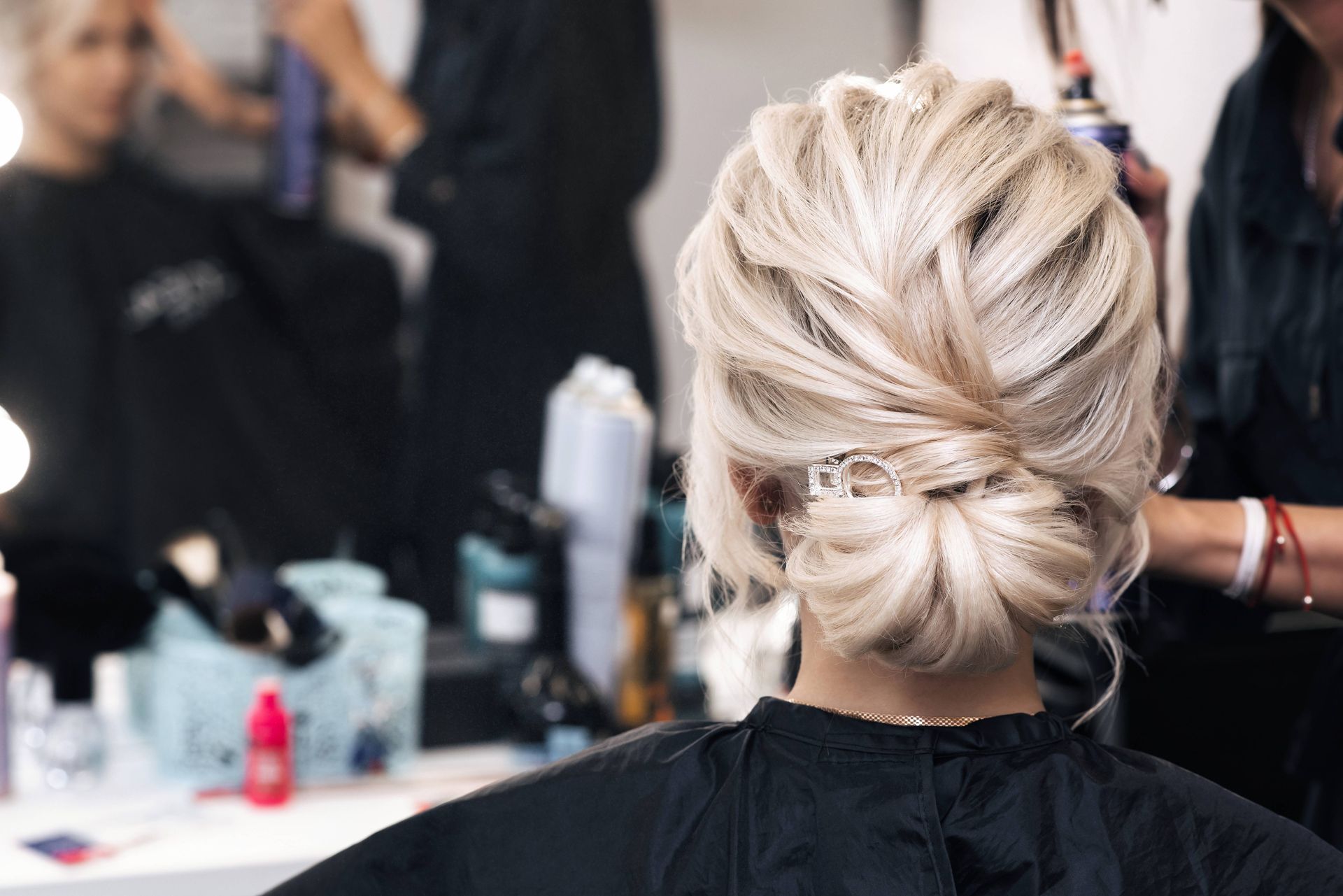 Someone changing the style of their hair at Lux Hair Bar in Lexington, Kentucky