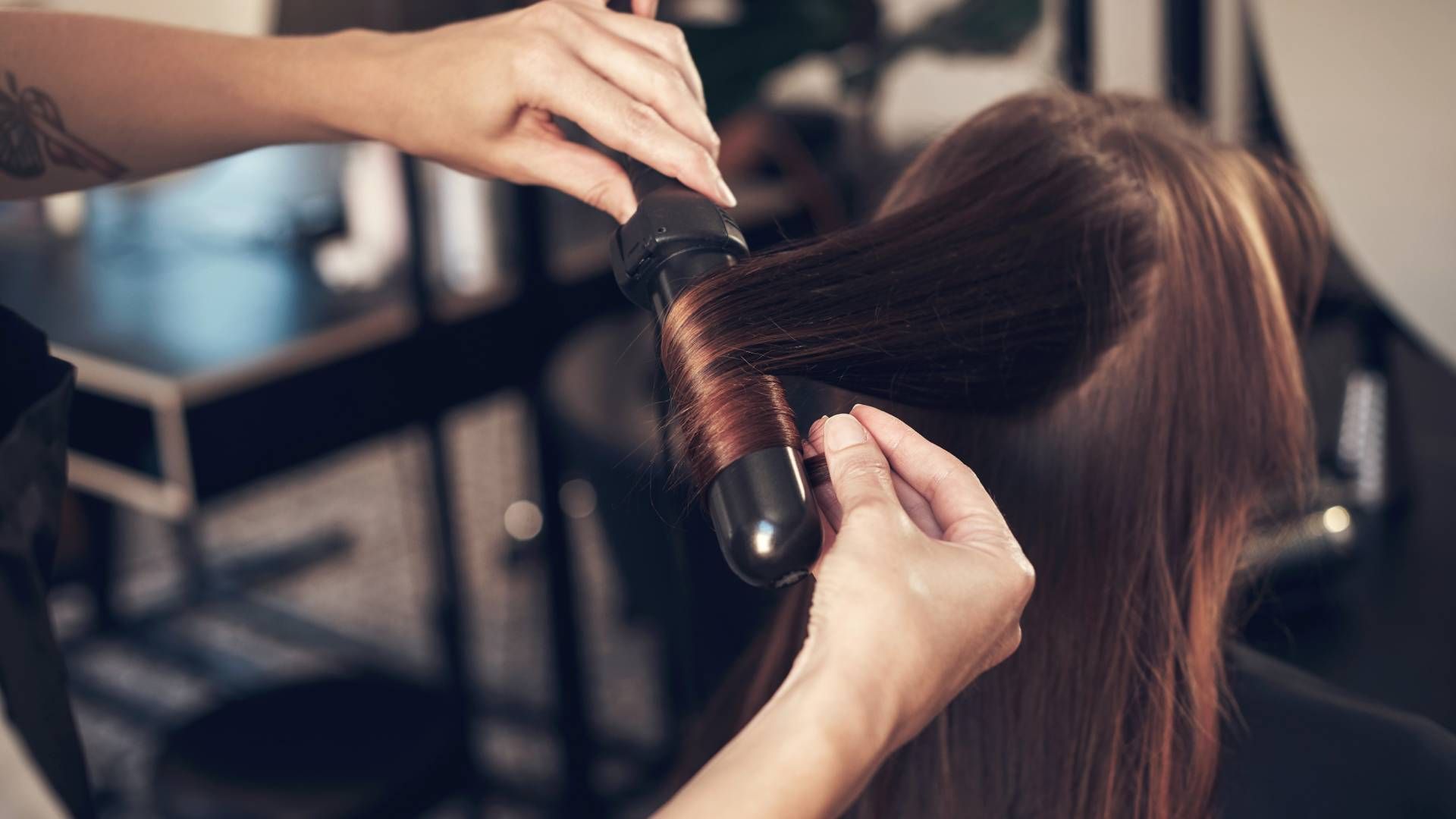 Someone getting a curling treatment with heat at Lux Hair Bar near Lexington, Kentucky (KY)