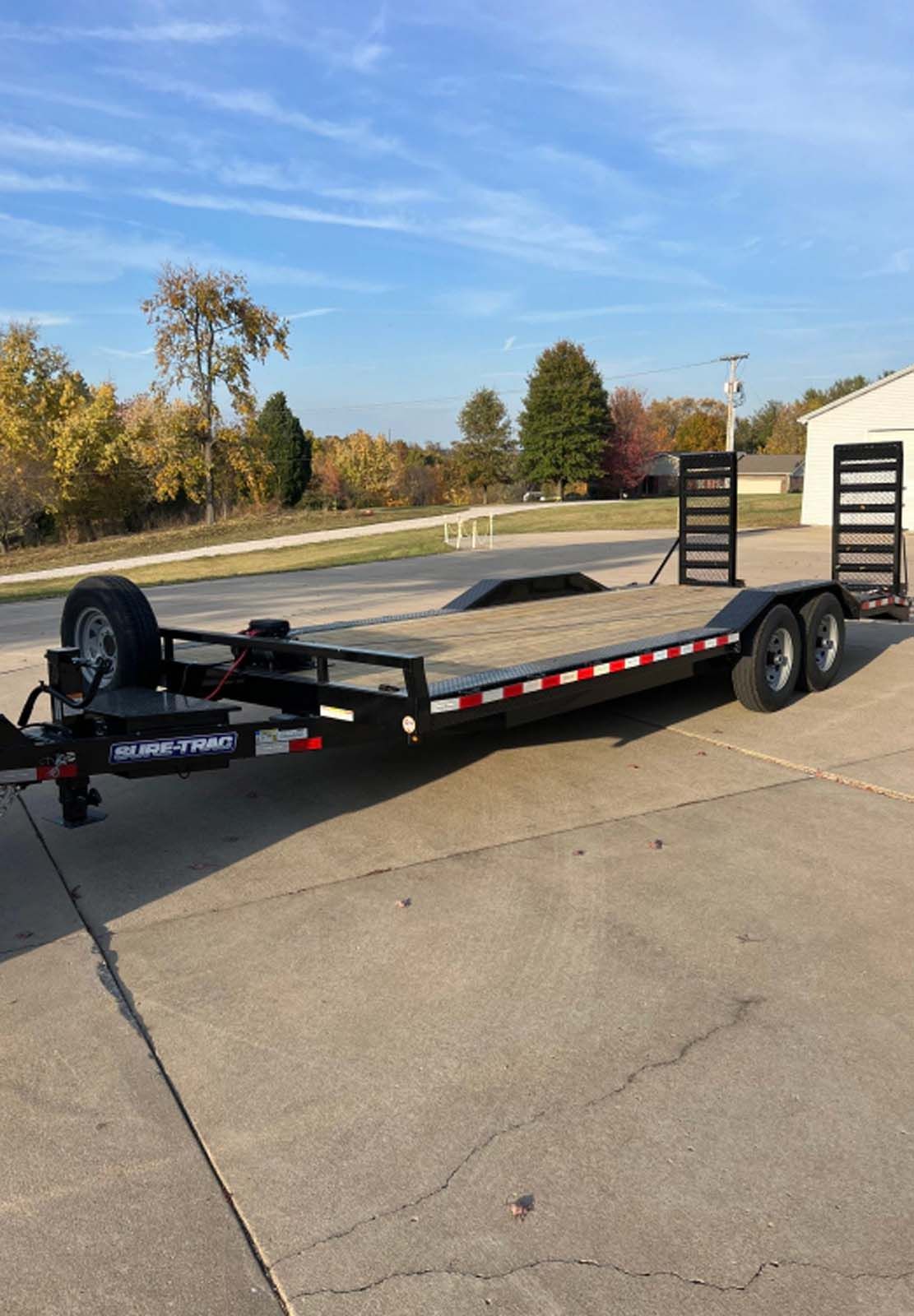 A trailer is parked on the side of the road.