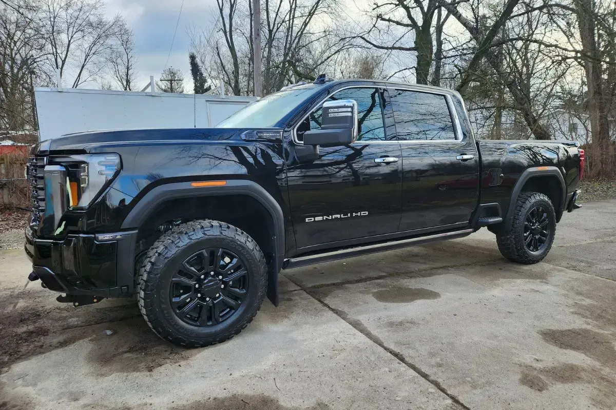 Black GMC truck parked outdoors.