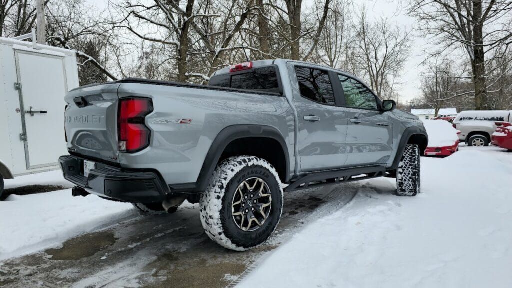 Gray Chevrolet pickup truck parked in the snow.