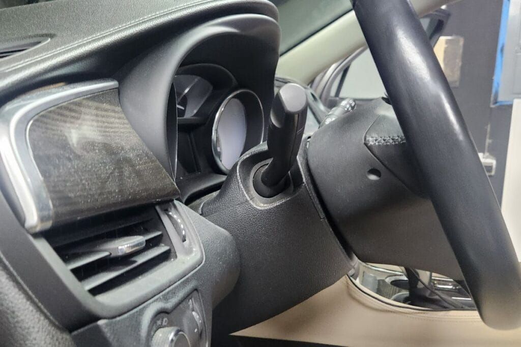 Dashboard and steering wheel inside a car.