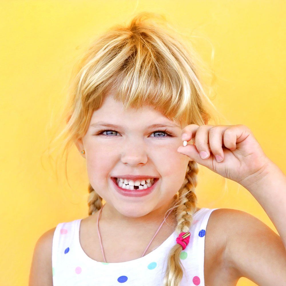 child with missing tooth