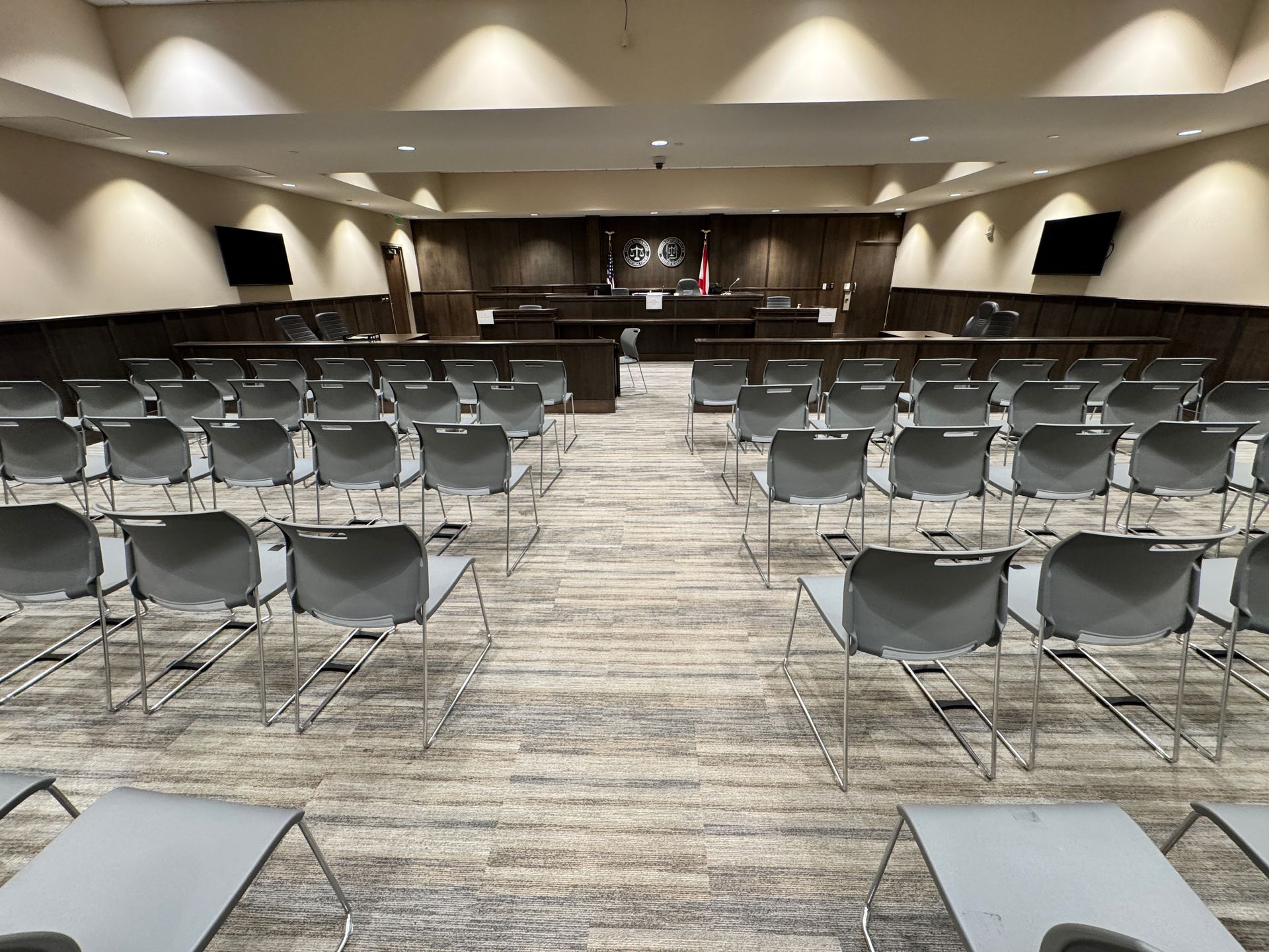 A large room filled with rows of chairs and tables.
